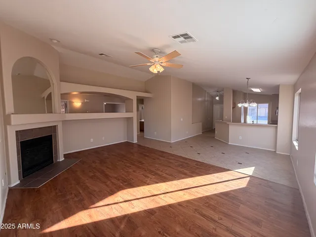 a view of a kitchen with a sink and a fireplace