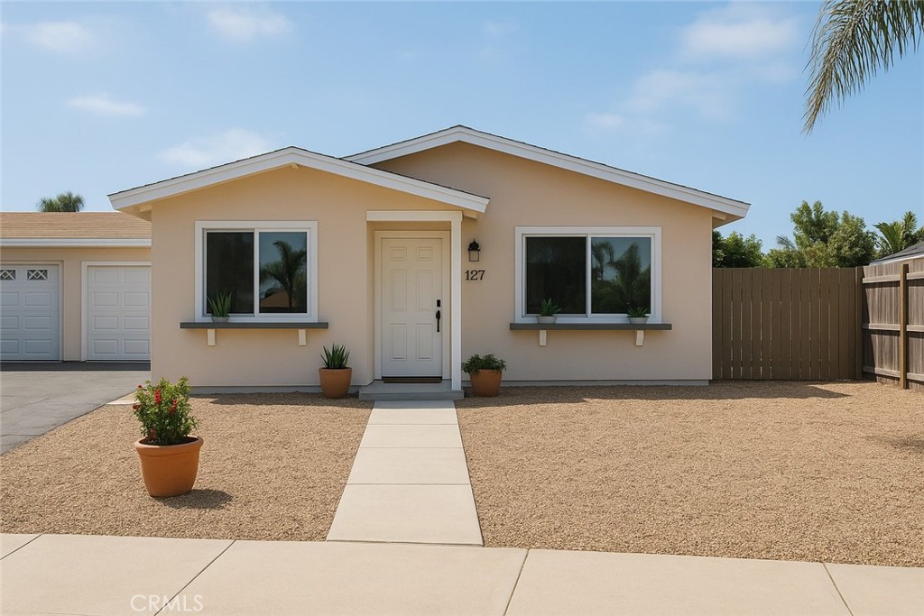 4493 Estada Drive Oceanside, CA 92057 - Photo 1 of 38 a front view of a house with a yard