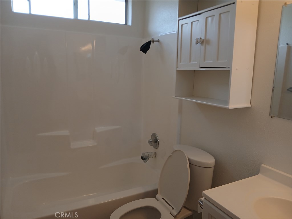 4493 Estada Drive Oceanside, CA 92057 - Photo 21 of 38 a bathroom with a toilet and a shower