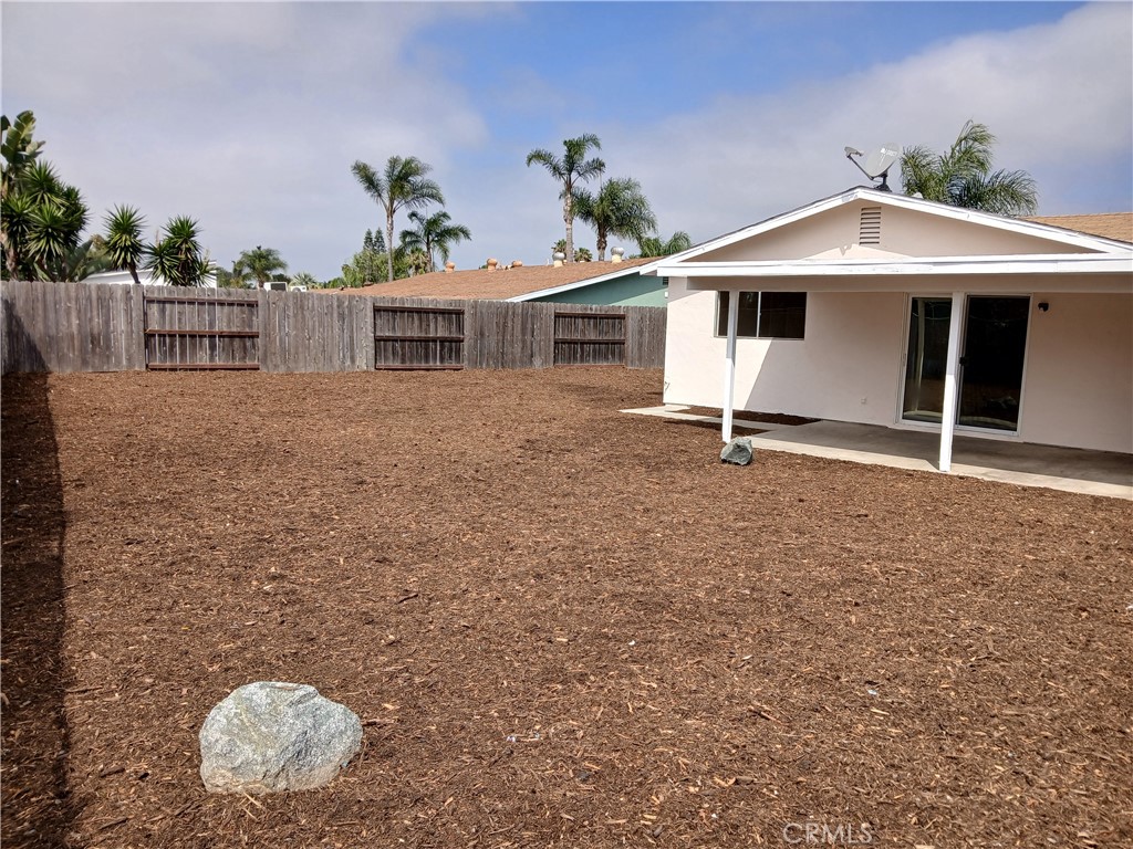 4493 Estada Drive Oceanside, CA 92057 - Photo 4 of 38 a front view of a house with a yard