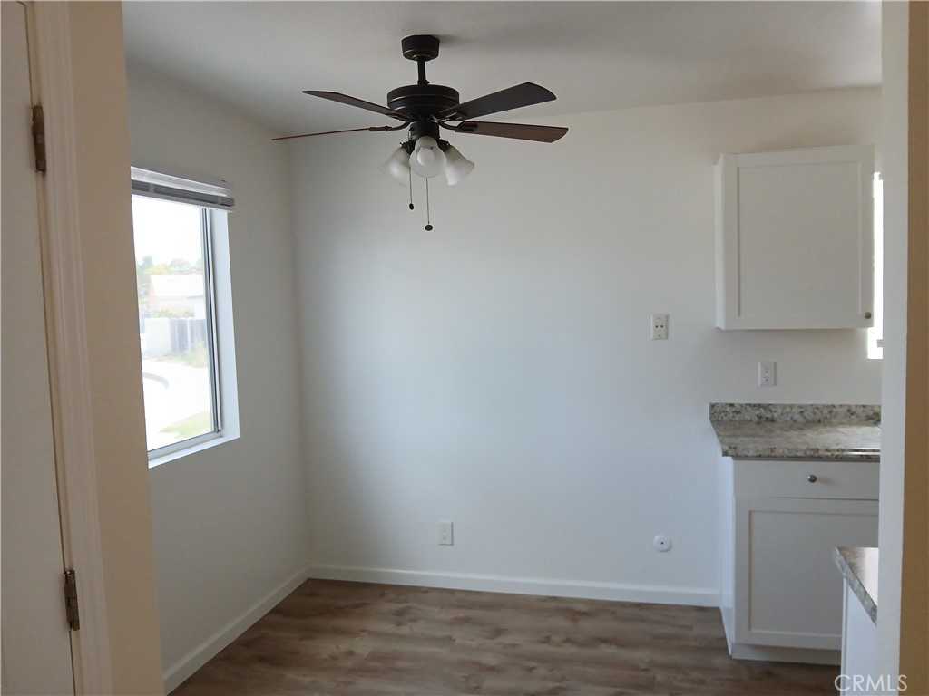 4493 Estada Drive Oceanside, CA 92057 - Photo 9 of 38 an empty room with a window and a ceiling fan