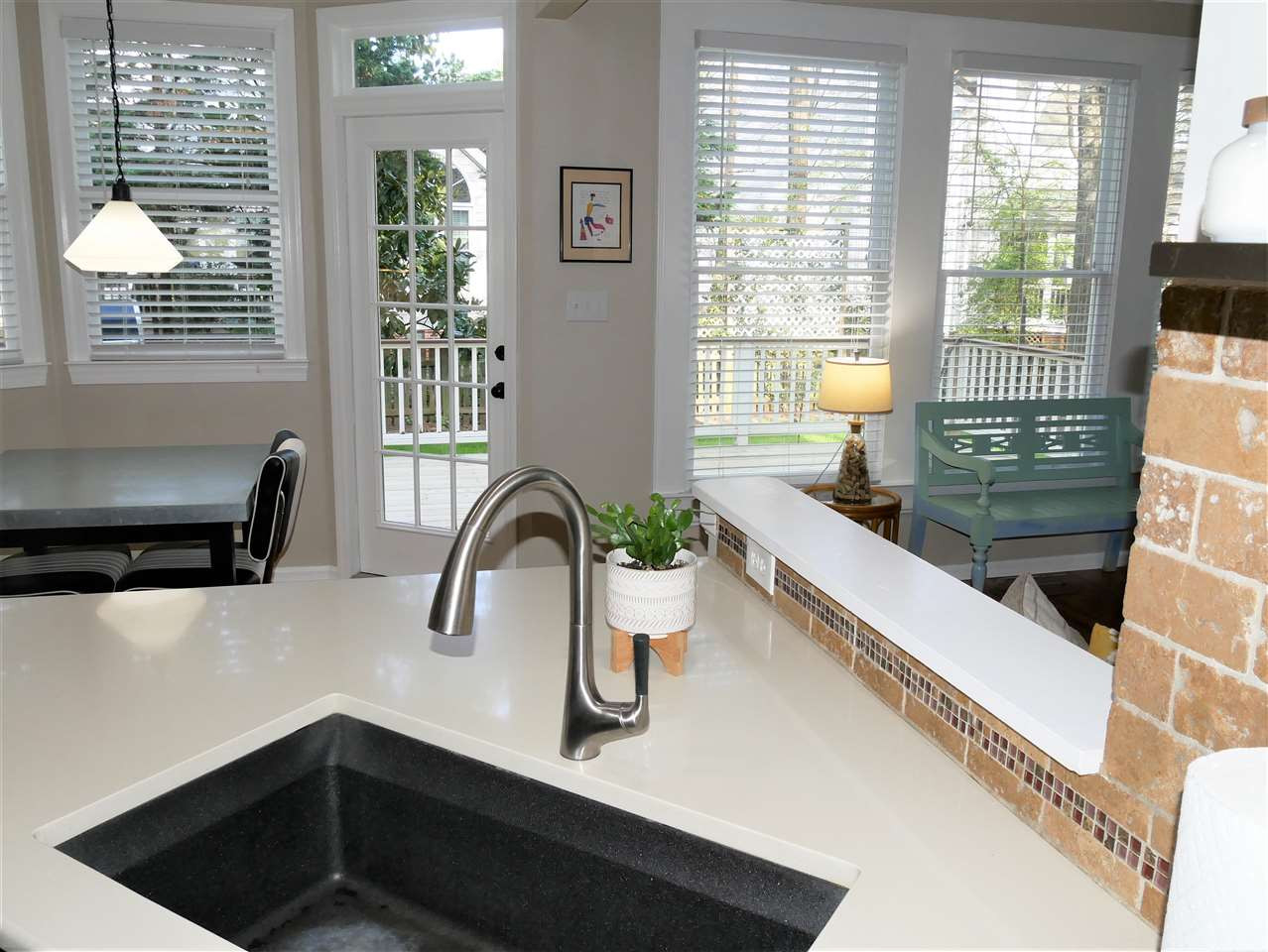 8512 Wheeling Drive Raleigh, NC 27615 - Photo 10 of 30 Kitchen is open to the family room and is so bright and welcoming! Huge black, deep sink is awesome! Kitchen