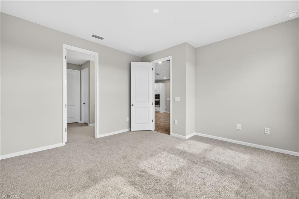 4563 Arboretum Circle, Unit 202 Naples, FL 34112 - Photo 12 of 22 master Bedroom