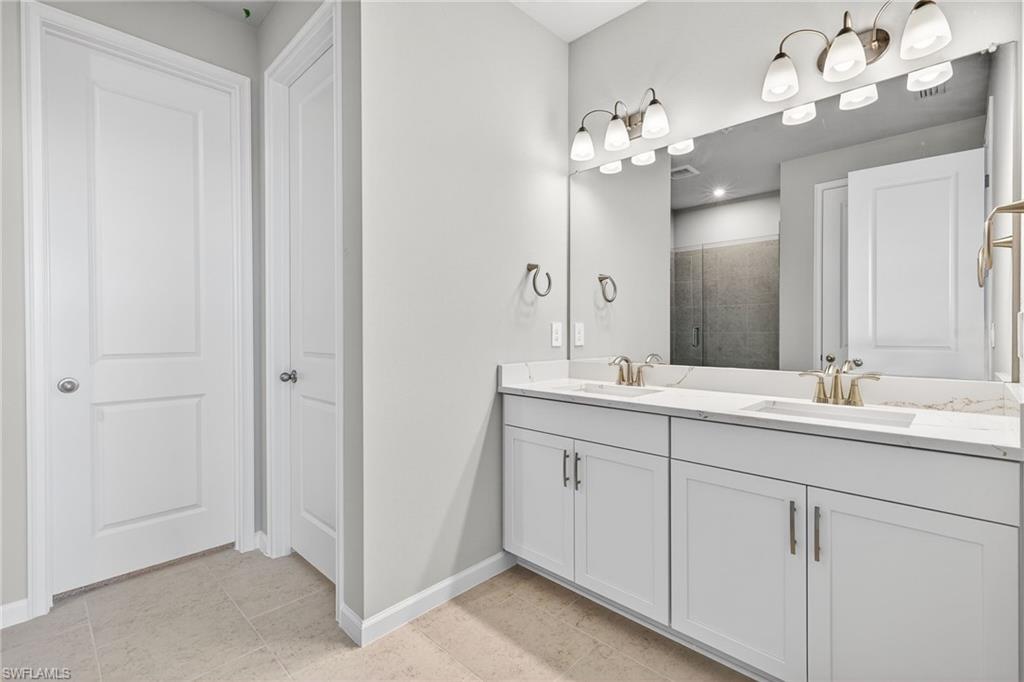 4563 Arboretum Circle, Unit 202 Naples, FL 34112 - Photo 14 of 22 Master bathroom