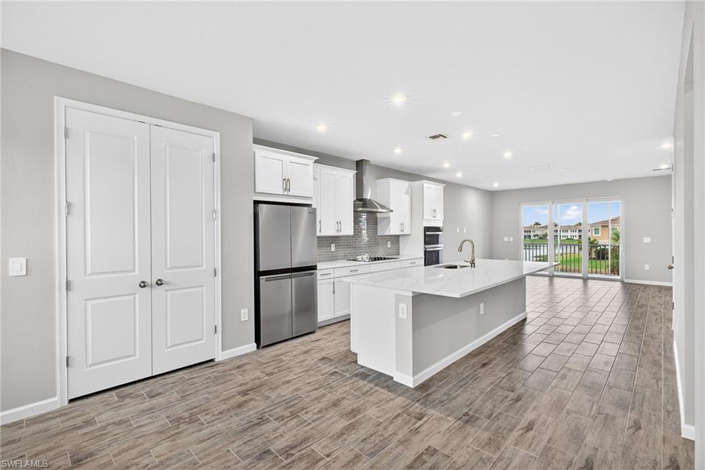 4563 Arboretum Circle, Unit 202 Naples, FL 34112 - Photo 2 of 22 Pantry next to kitchen