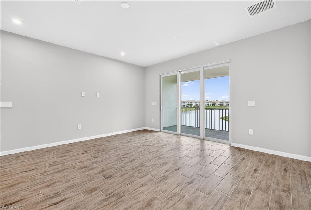 4563 Arboretum Circle, Unit 202 Naples, FL 34112 - Photo 9 of 22 Open living area