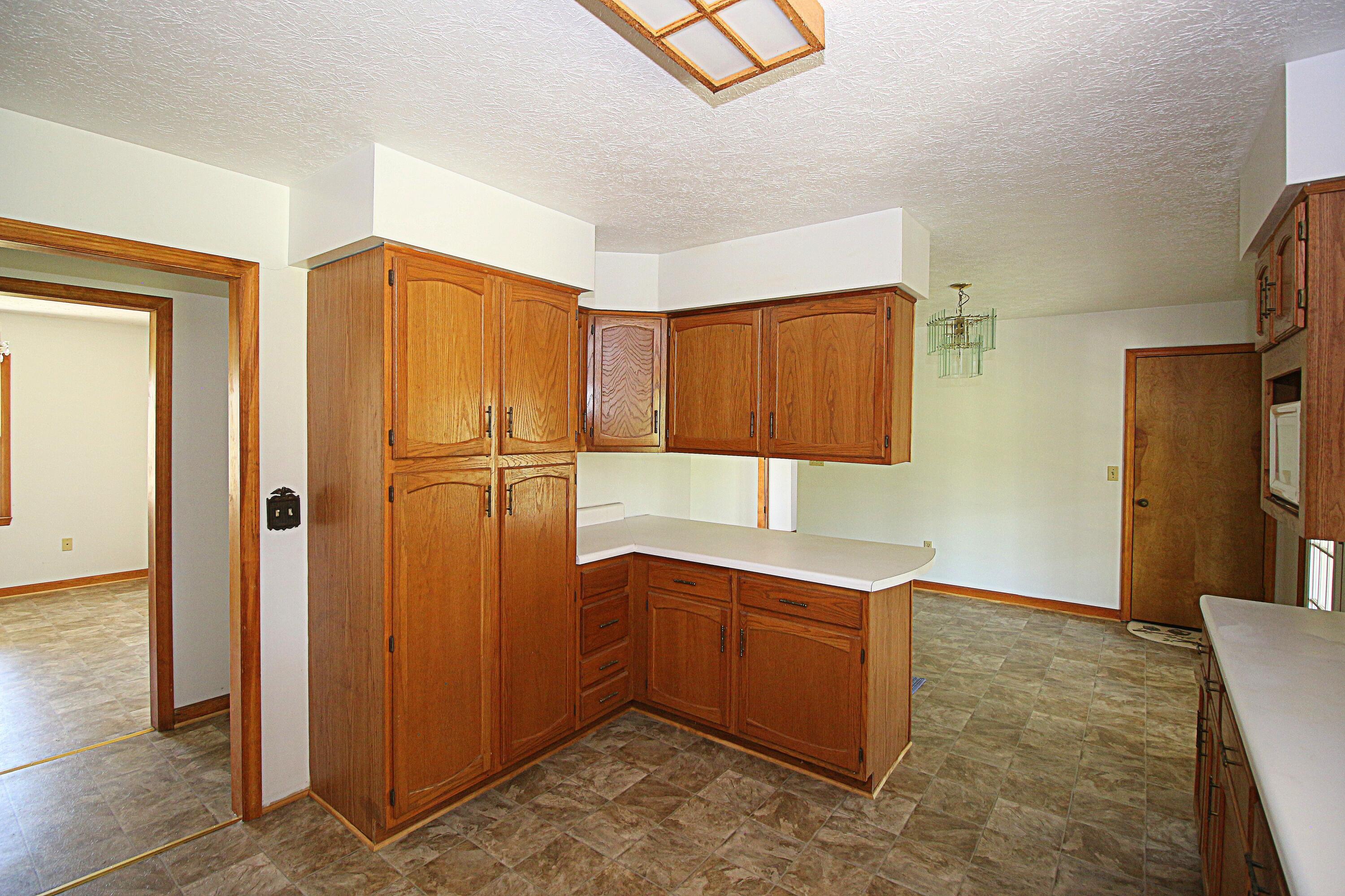7080 Belspring Road Radford, VA 24141 - Photo 14 of 53 a kitchen with stainless steel appliances granite countertop a refrigerator and a sink