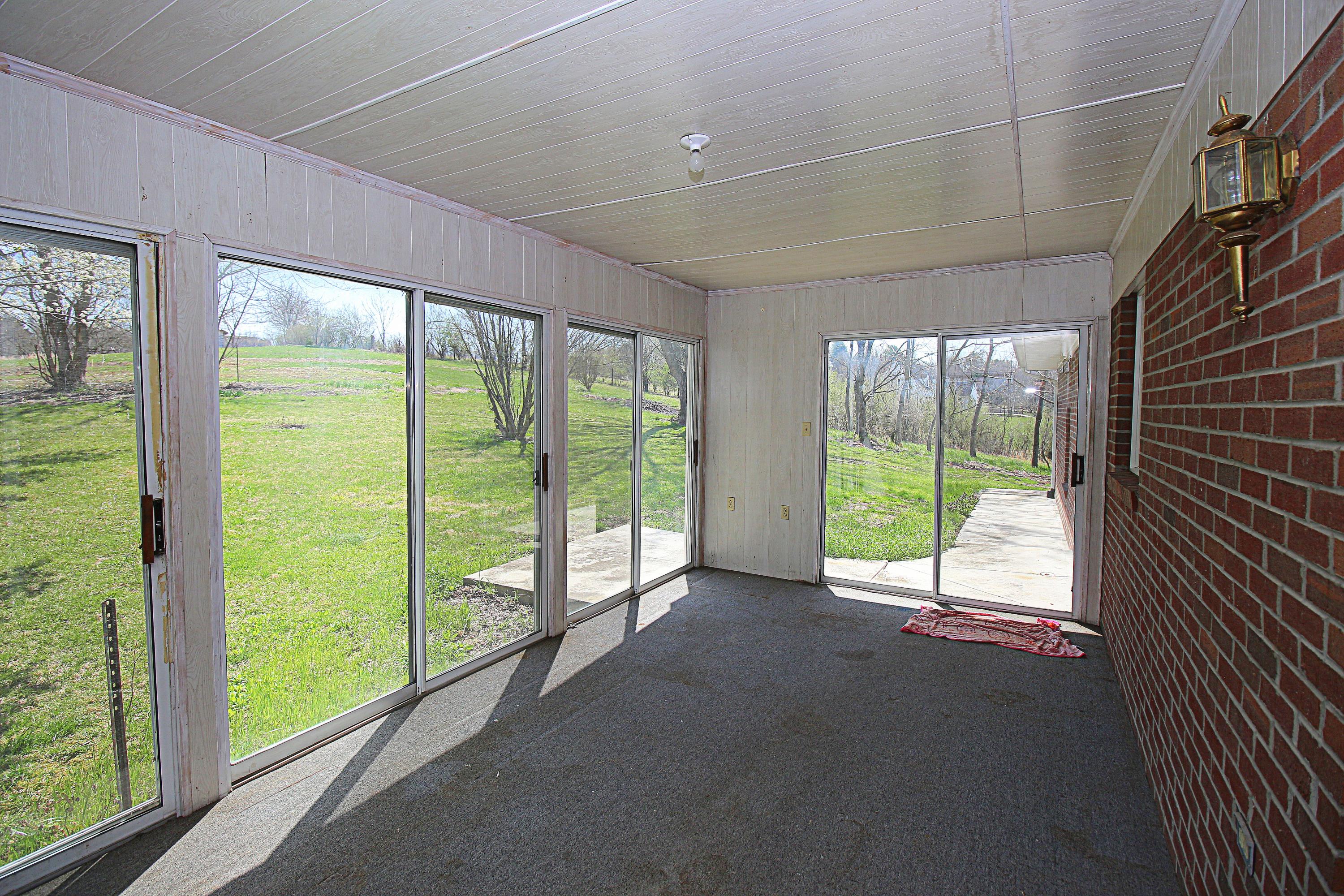 7080 Belspring Road Radford, VA 24141 - Photo 17 of 53 a view of an empty room with windows