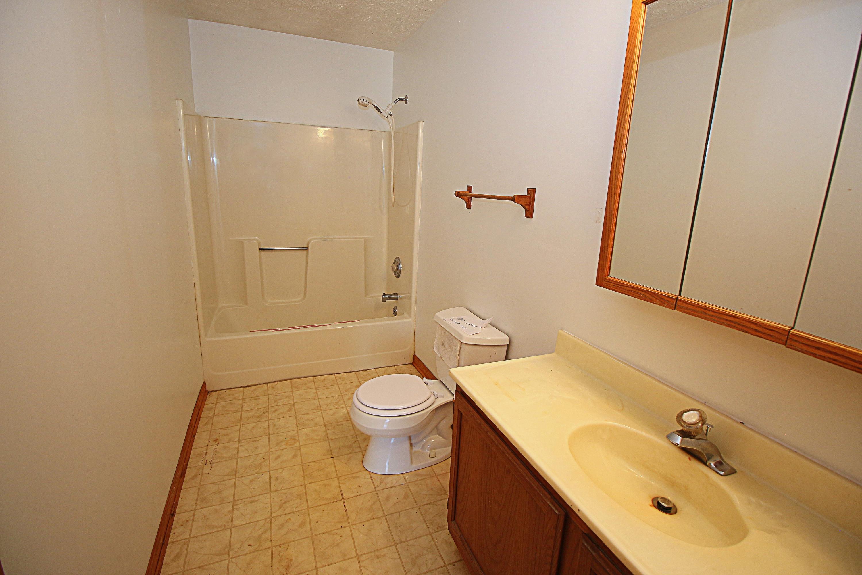 7080 Belspring Road Radford, VA 24141 - Photo 25 of 53 a bathroom with a sink toilet and shower