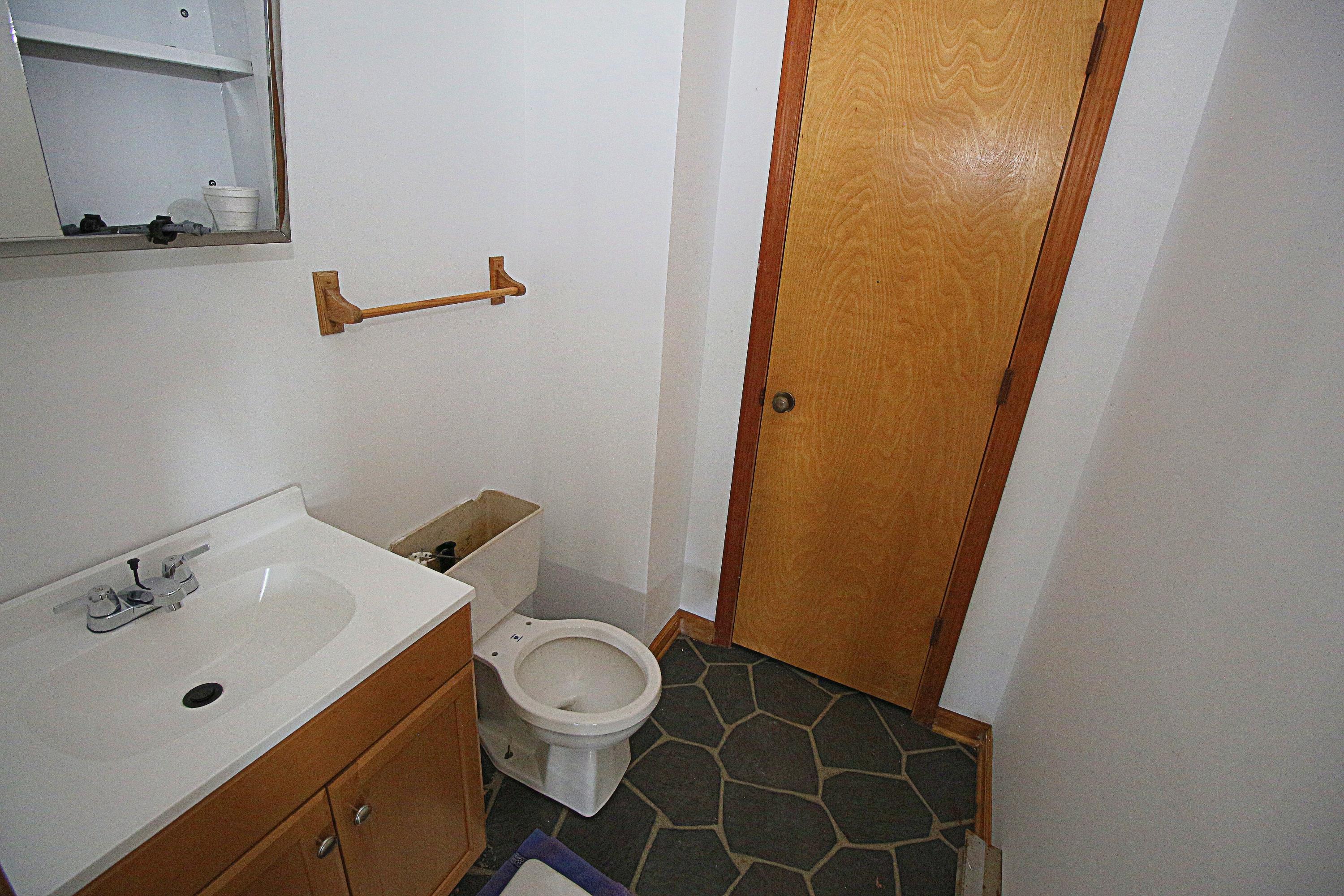 7080 Belspring Road Radford, VA 24141 - Photo 26 of 53 a bathroom with a sink and a mirror