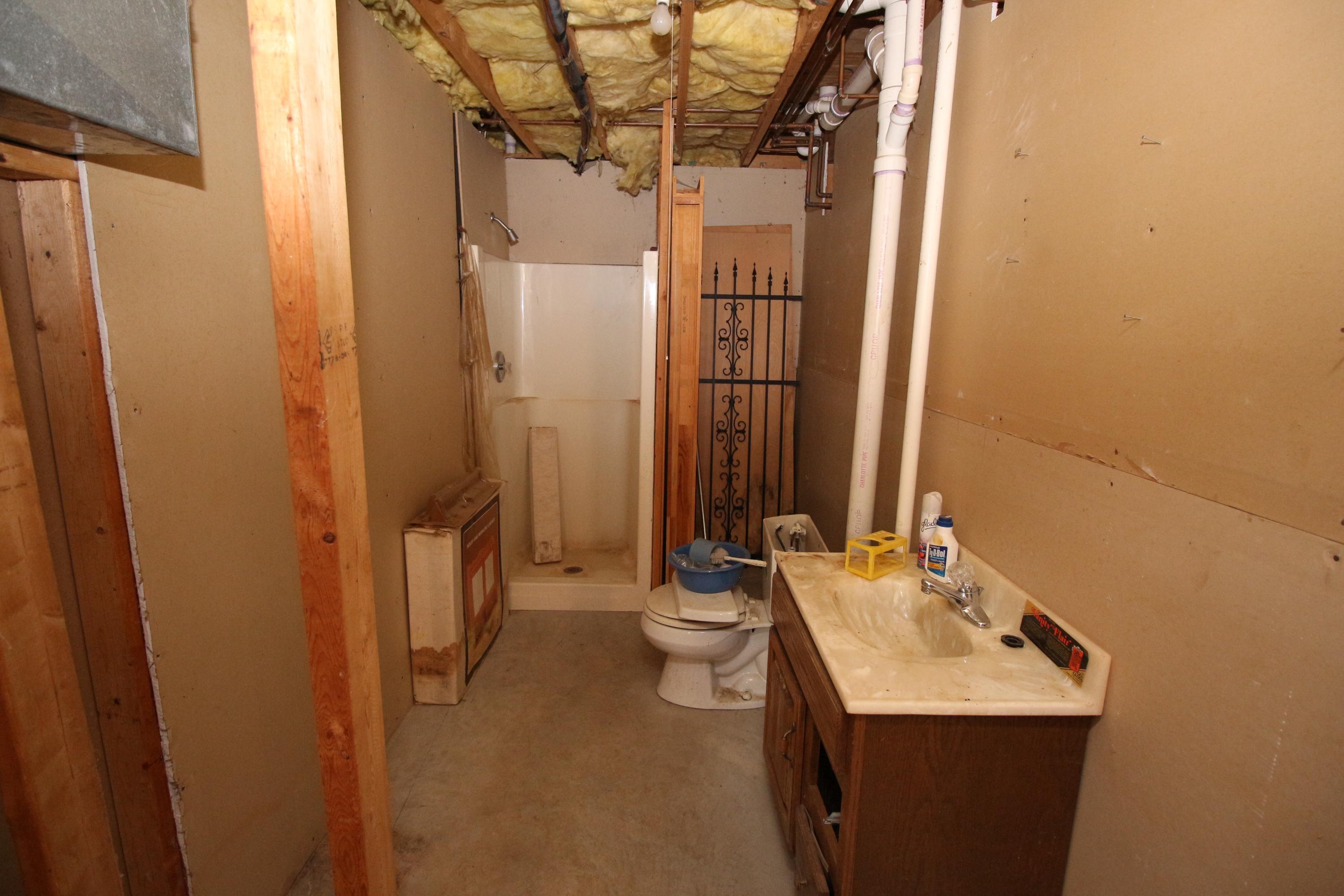 7080 Belspring Road Radford, VA 24141 - Photo 31 of 53 a bathroom with a sink and mirror with toilet