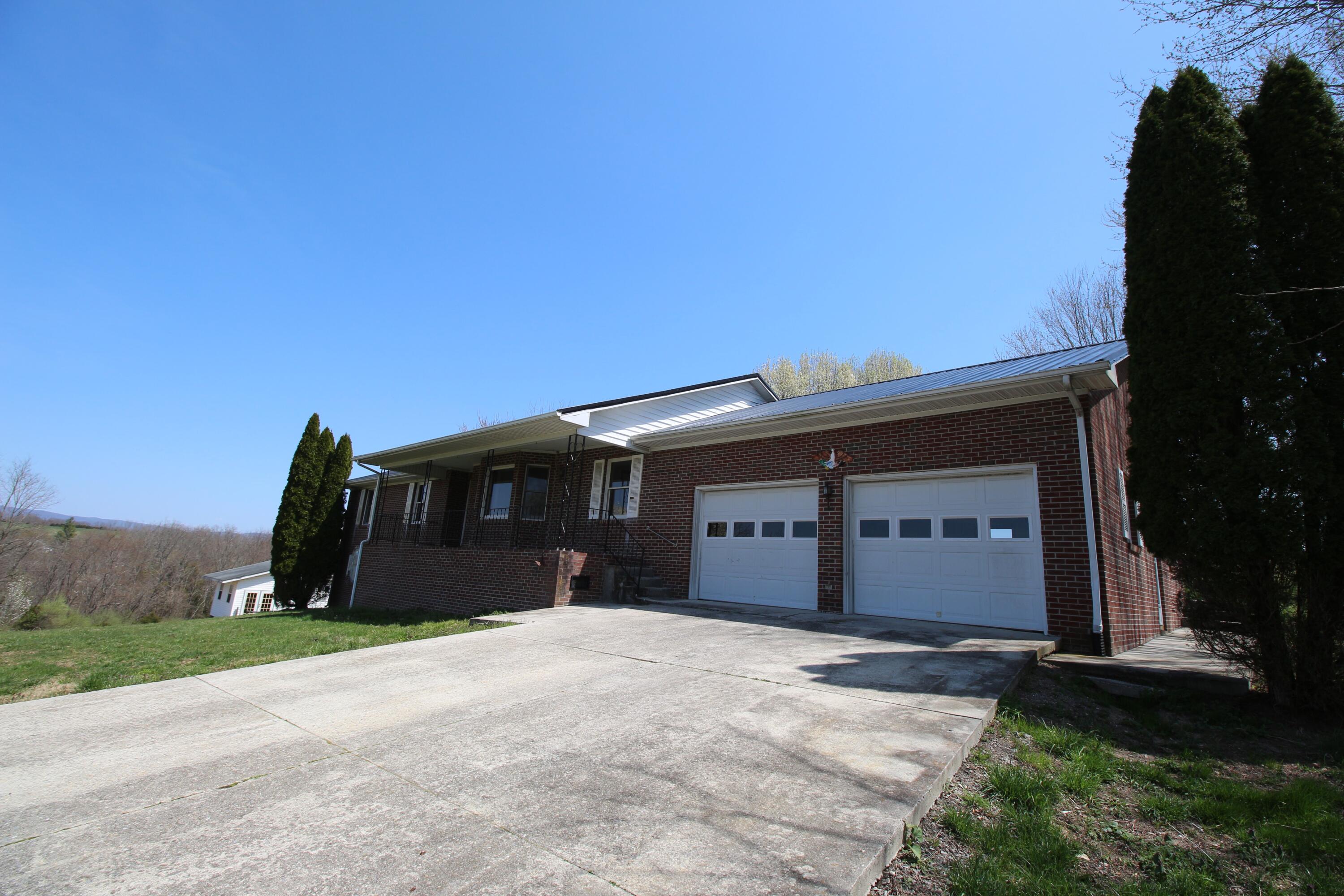 7080 Belspring Road Radford, VA 24141 - Photo 36 of 53 a view of a house with a yard