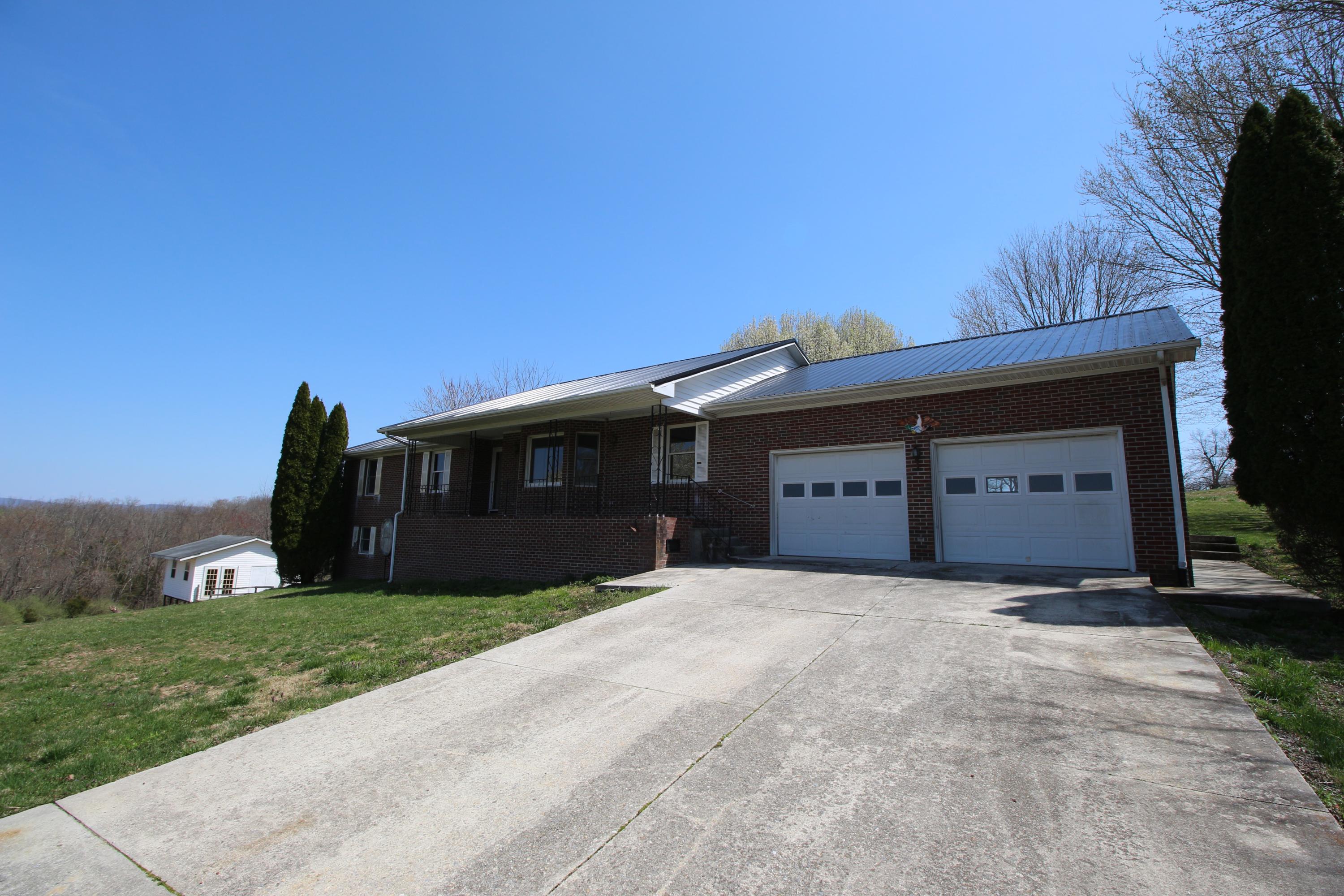 7080 Belspring Road Radford, VA 24141 - Photo 37 of 53 a front view of a house with a yard