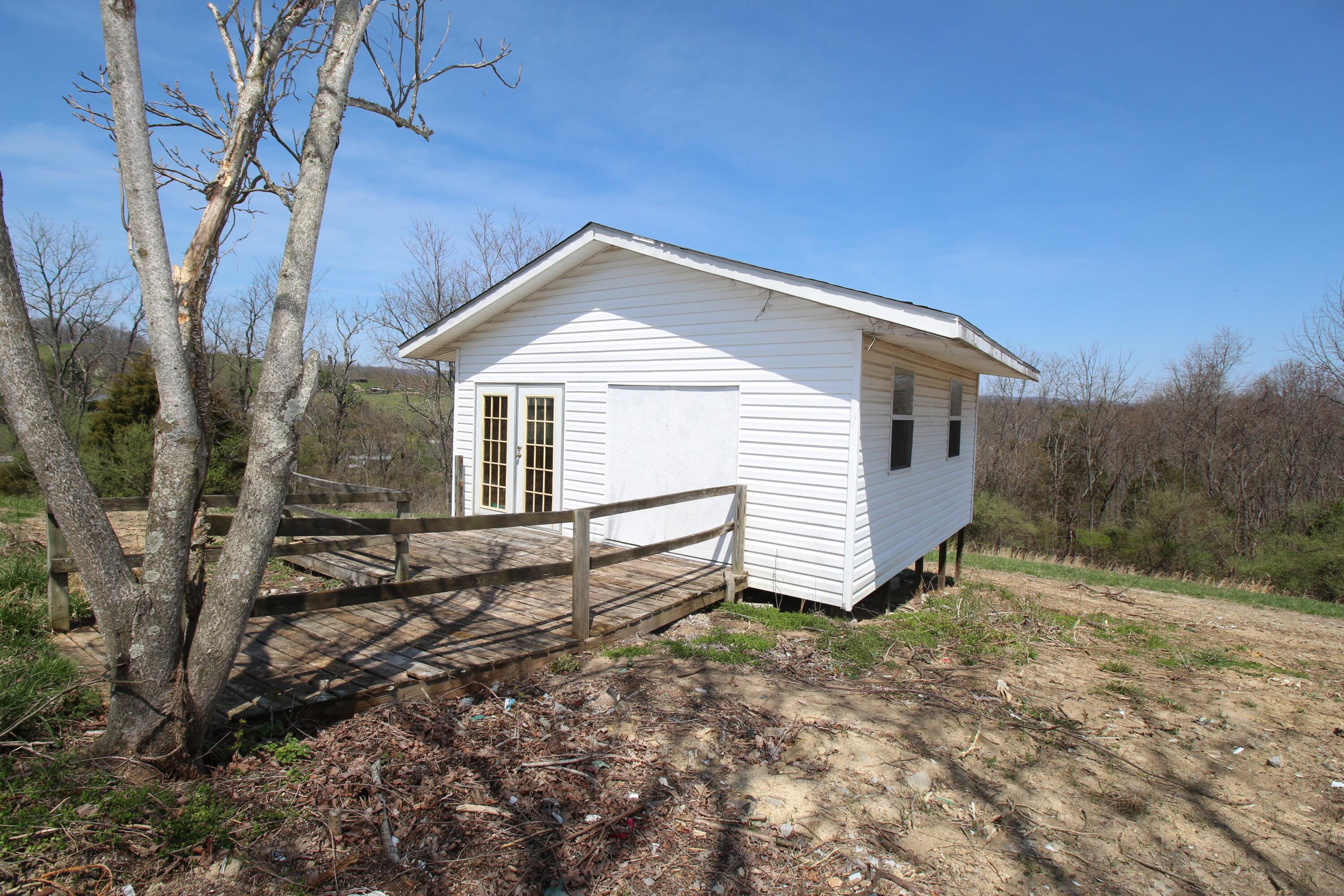 7080 Belspring Road Radford, VA 24141 - Photo 42 of 53 a view of a house with a yard