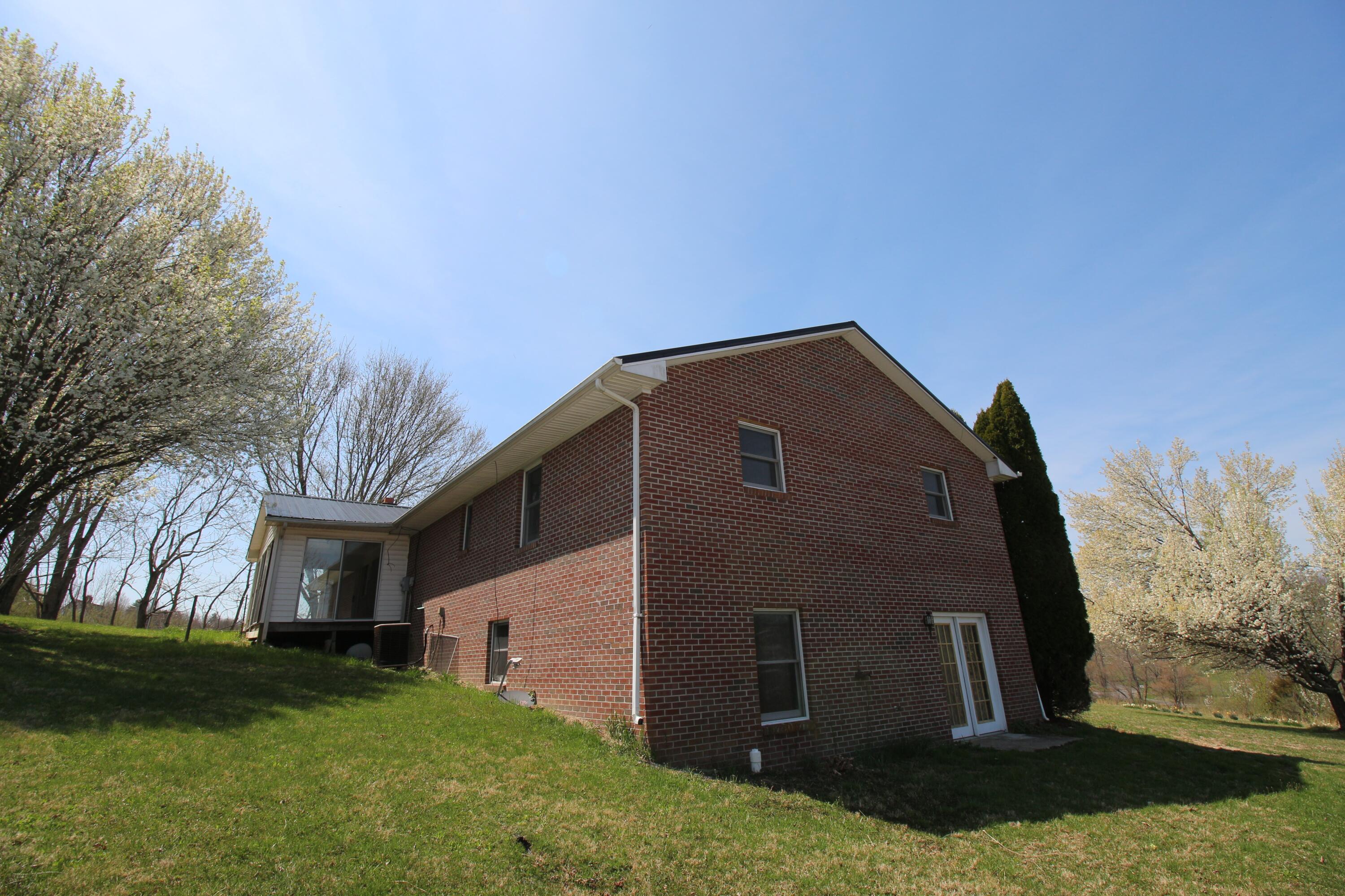 7080 Belspring Road Radford, VA 24141 - Photo 43 of 53 a front view of a house with a yard