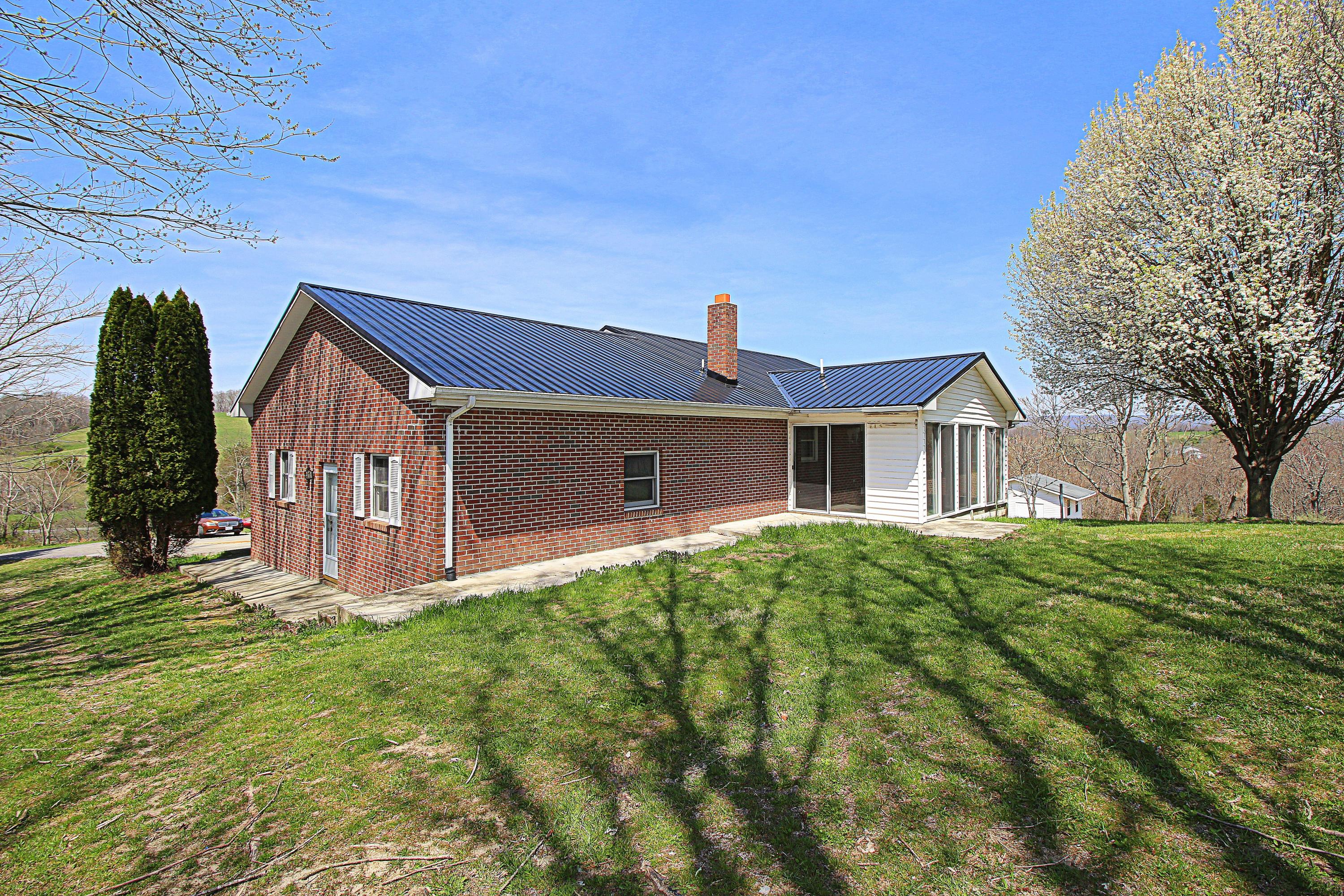 7080 Belspring Road Radford, VA 24141 - Photo 45 of 53 a front view of a house with garden