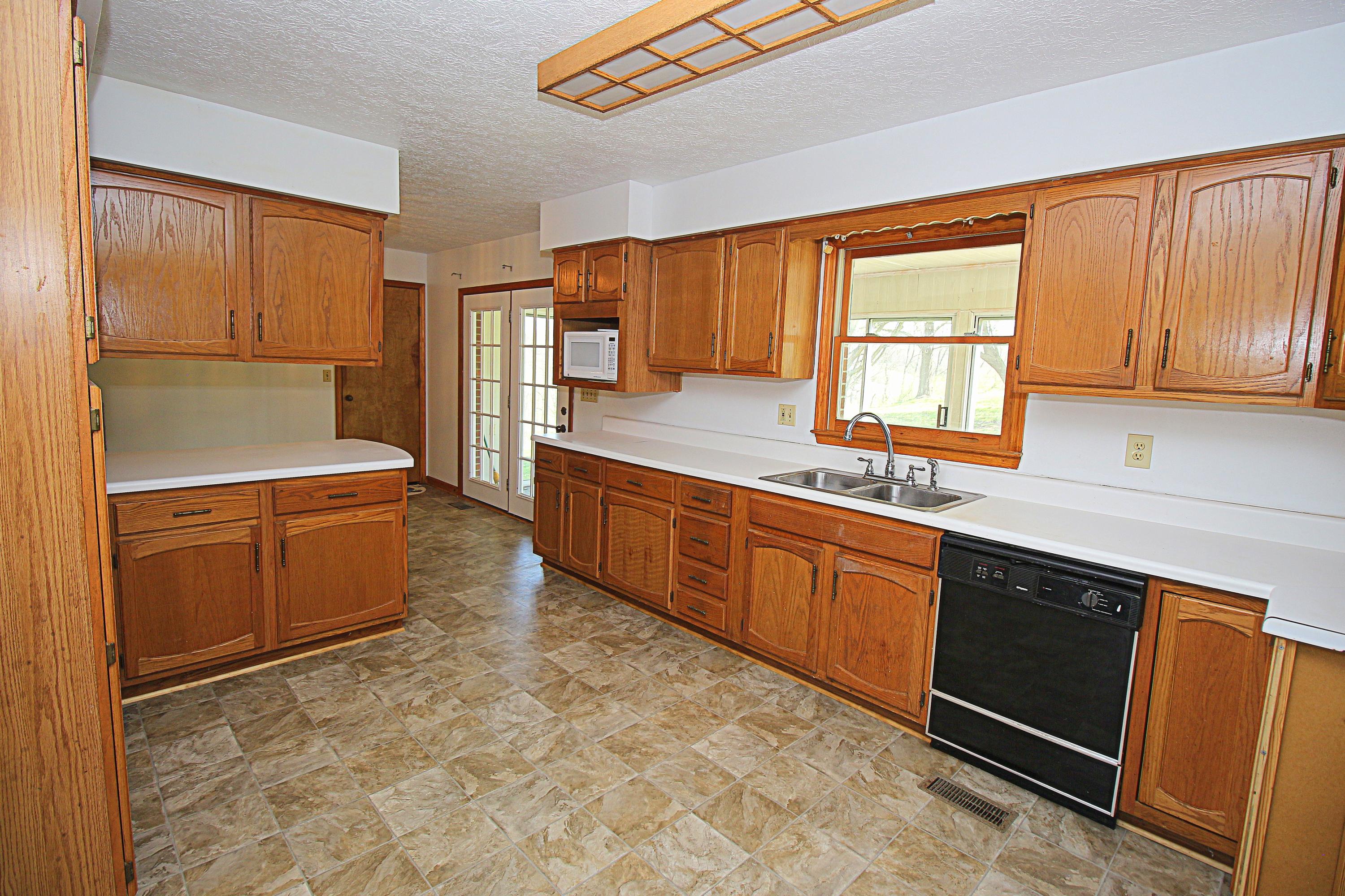 7080 Belspring Road Radford, VA 24141 - Photo 10 of 53 a kitchen with stainless steel appliances granite countertop a sink stove and cabinets