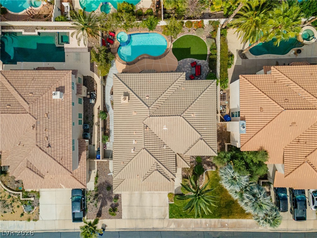 2504 Putting Green Drive Henderson, NV 89074 - Photo 47 of 56 An aerial view showcases a residence featuring a pool, hot tub, and well-maintained landscaping.