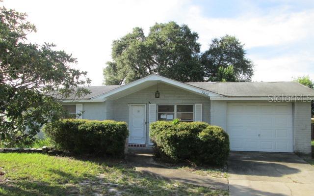 7830 Greybirch Terrace Port Richey, FL 34668 - Photo 1 of 1 a view of a house with a yard and potted plants