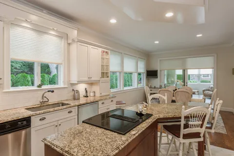 a kitchen with a stove a sink and a refrigerator
