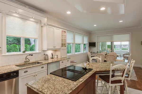 a kitchen with a stove a sink and a refrigerator
