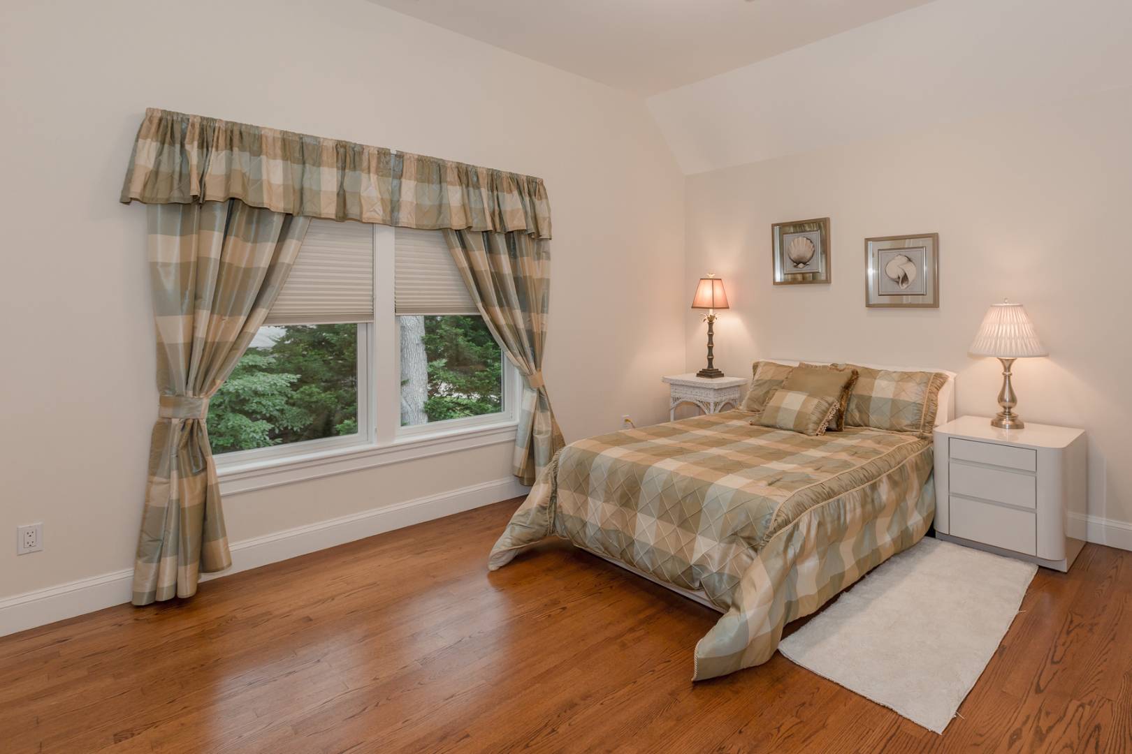 91 Beach Road Westhampton Beach, NY 11978 - Photo 17 of 23 a bedroom with a bed and a large window