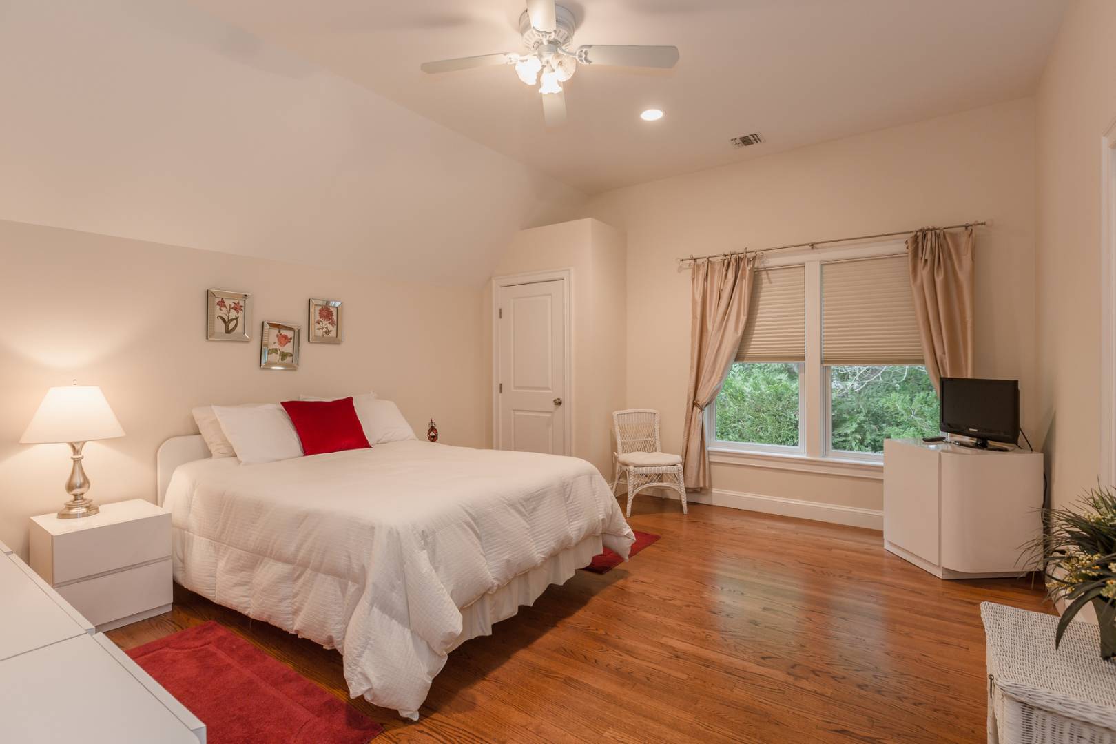 91 Beach Road Westhampton Beach, NY 11978 - Photo 18 of 23 a bedroom with a bed and a large window