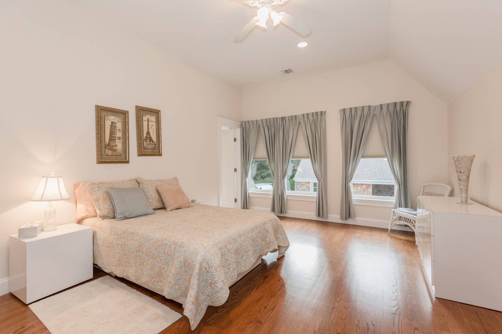 91 Beach Road Westhampton Beach, NY 11978 - Photo 19 of 23 a spacious bedroom with a large bed and a large window