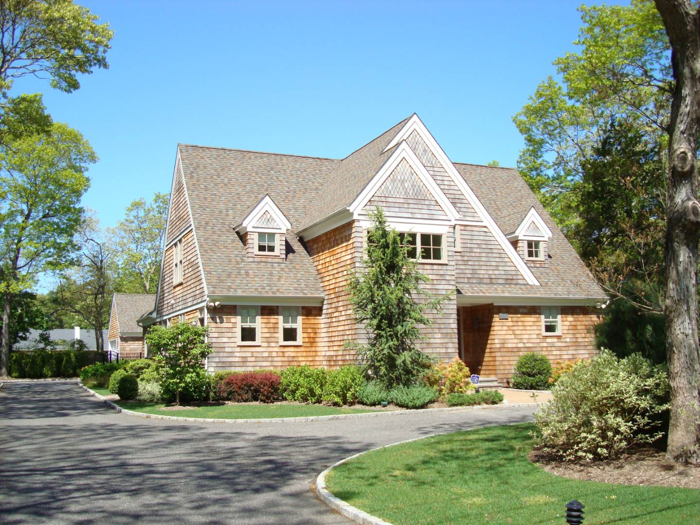 91 Beach Road Westhampton Beach, NY 11978 - Photo 2 of 23 a front view of a house with a yard