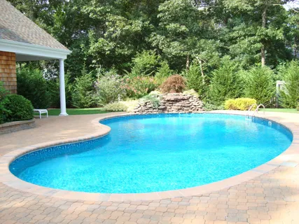 a view of swimming pool from a yard