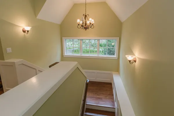 a view of a hallway with windows