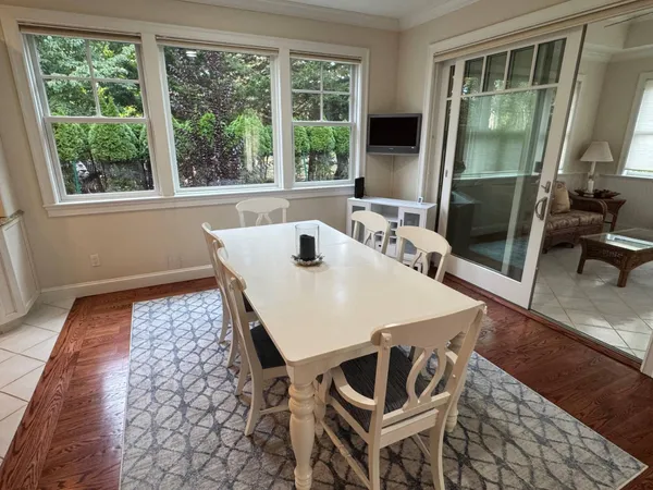 a view of a dining room with furniture and a window