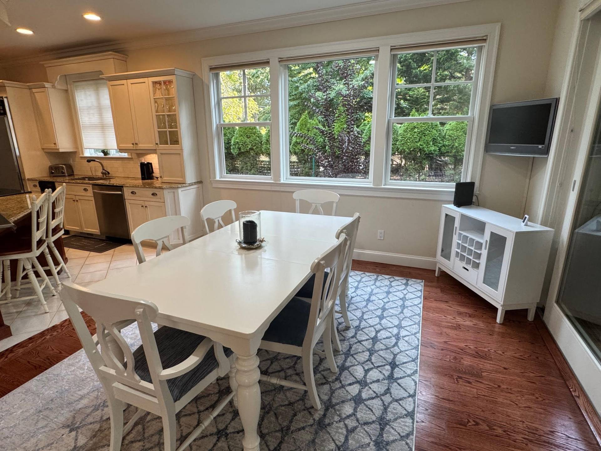 91 Beach Road Westhampton Beach, NY 11978 - Photo 9 of 23 a view of a dining room with furniture window and wooden floor
