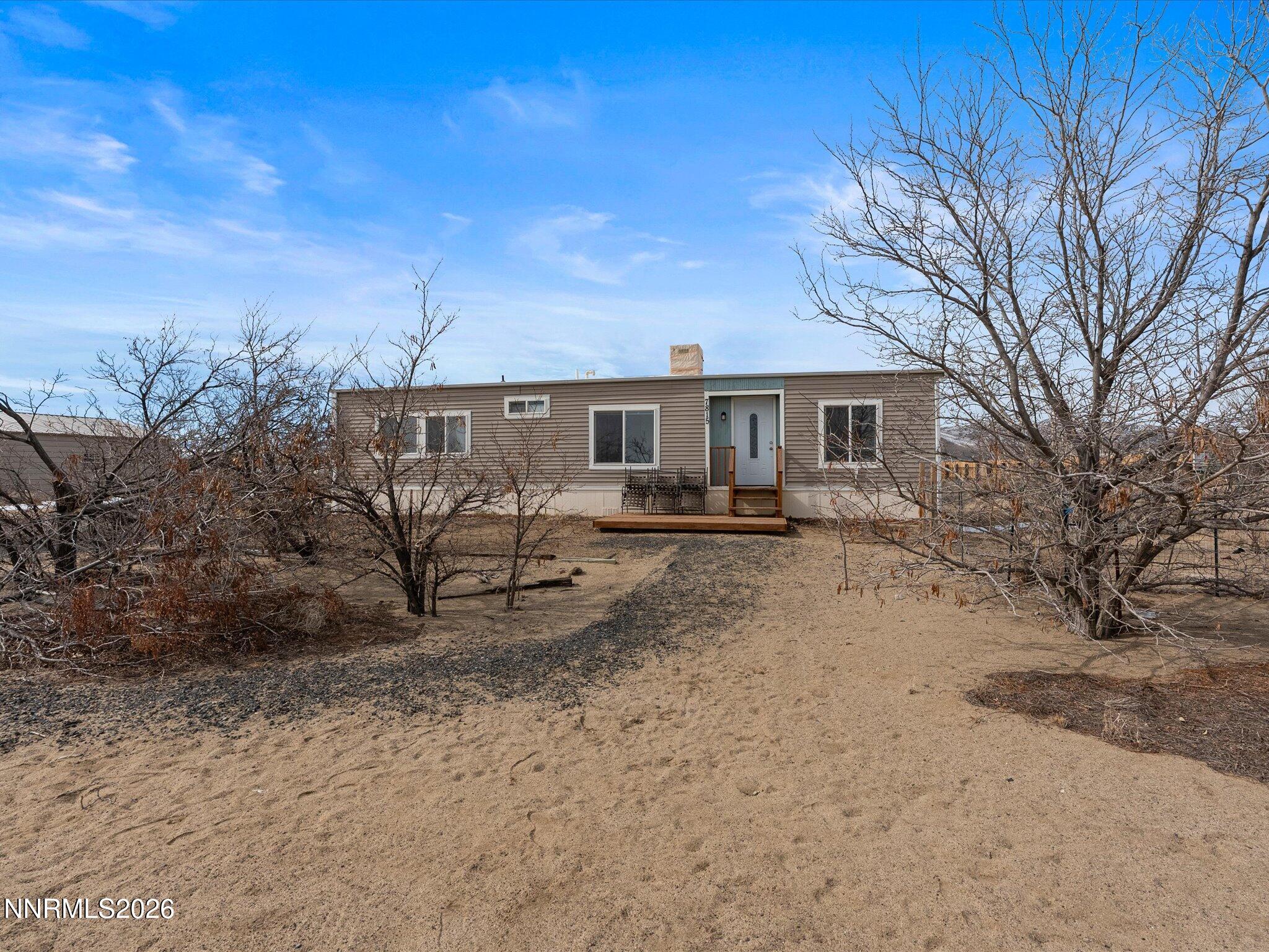 7815 Springfield Road Silver Springs, NV 89429 - Photo 1 of 46 a view of a yard with a patio