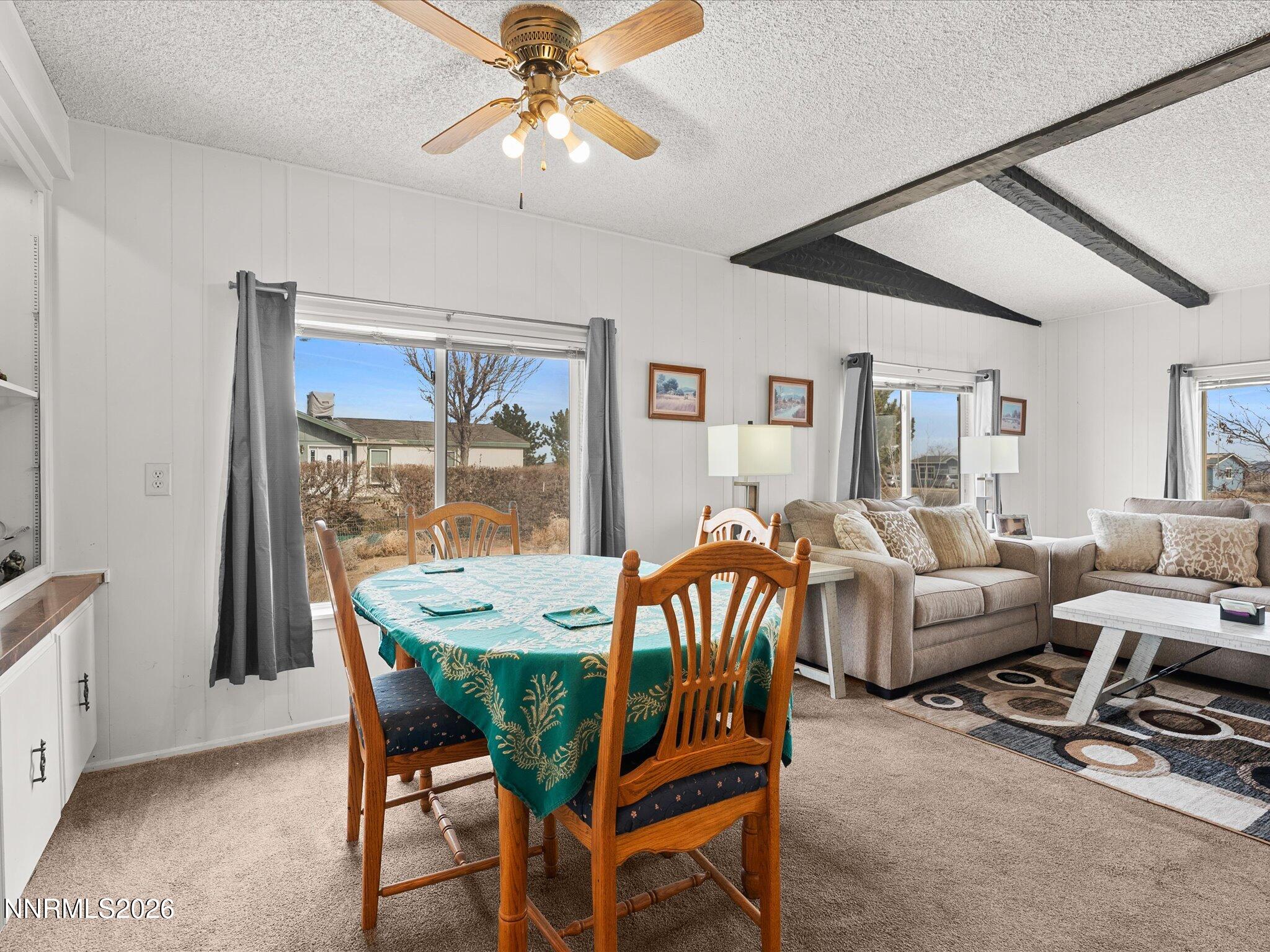 7815 Springfield Road Silver Springs, NV 89429 - Photo 11 of 46 a view of a dining room with furniture window and outside view