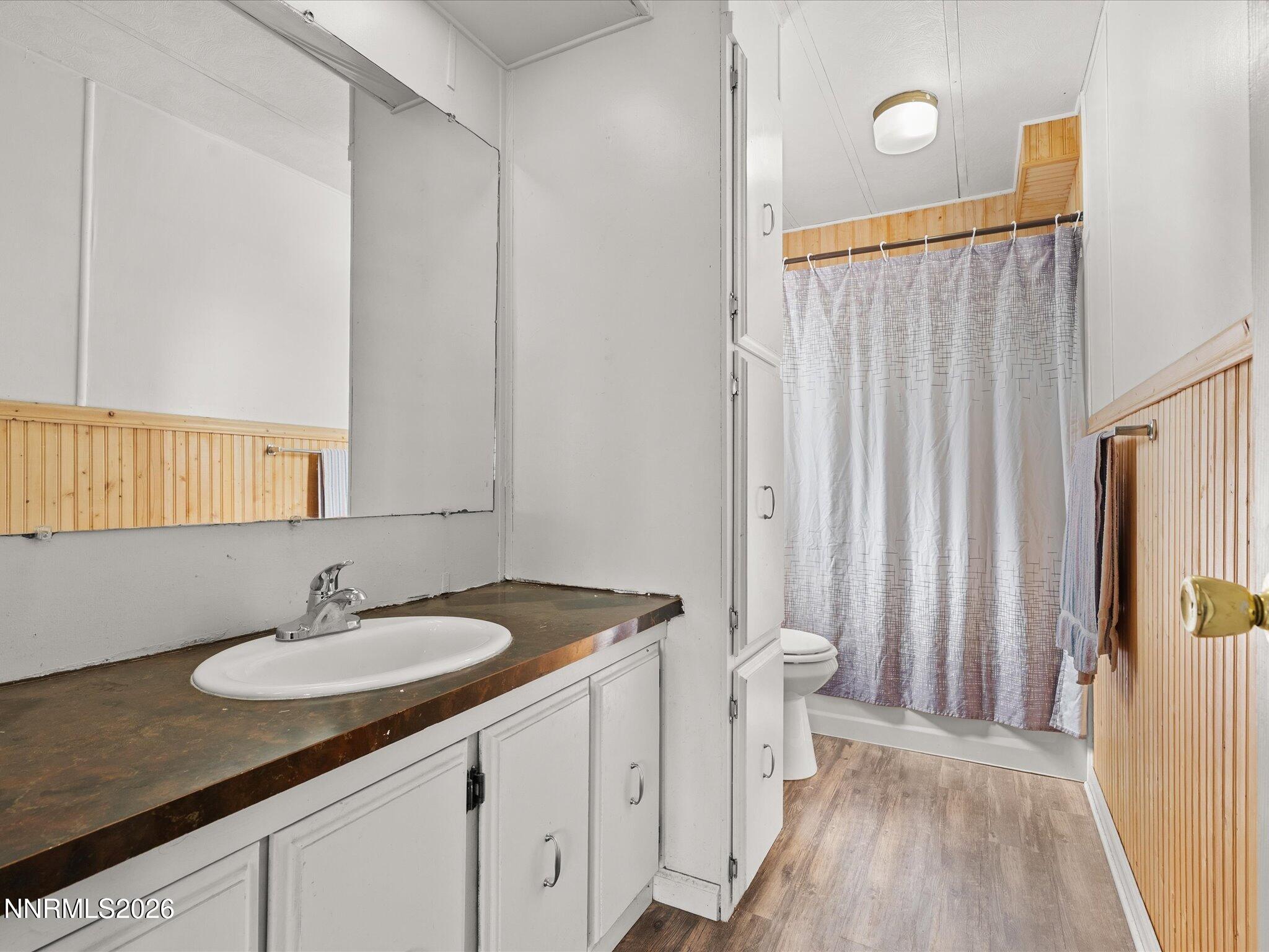 7815 Springfield Road Silver Springs, NV 89429 - Photo 21 of 46 a bathroom with a sink a toilet and shower