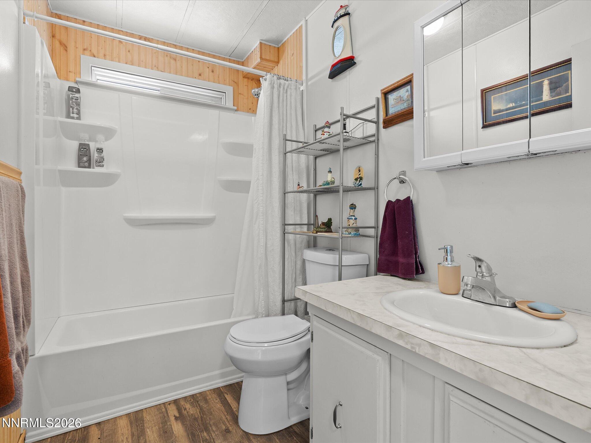 7815 Springfield Road Silver Springs, NV 89429 - Photo 23 of 46 a bathroom with a sink toilet and shower
