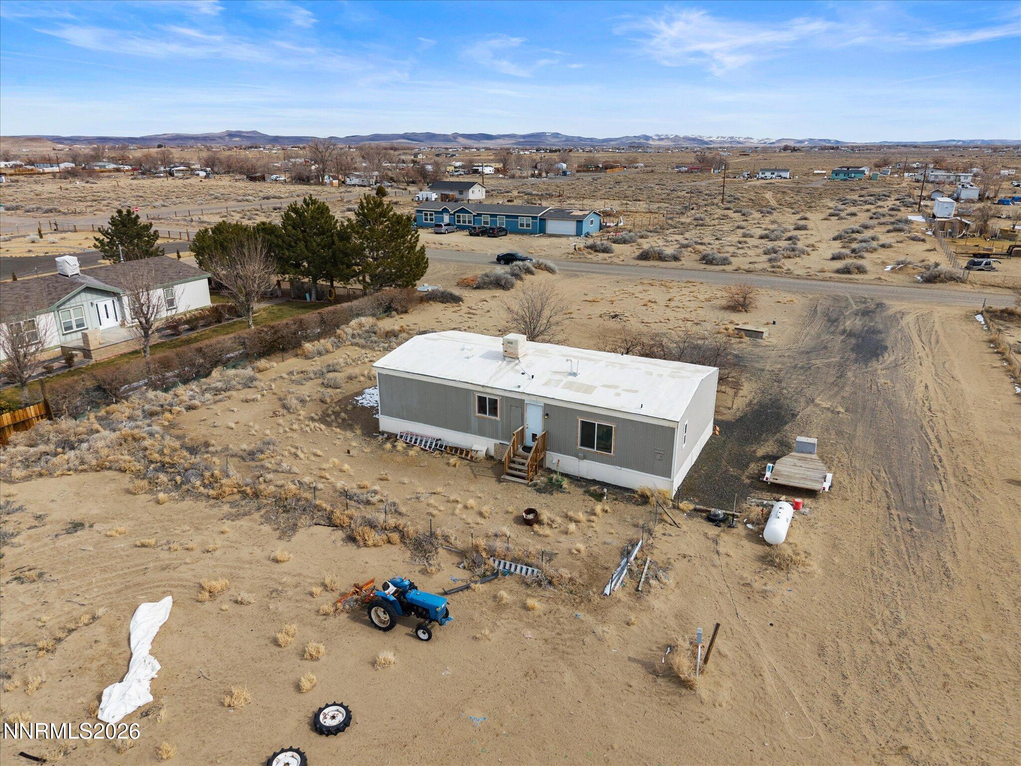 7815 Springfield Road Silver Springs, NV 89429 - Photo 37 of 46 an aerial view of a house with a yard