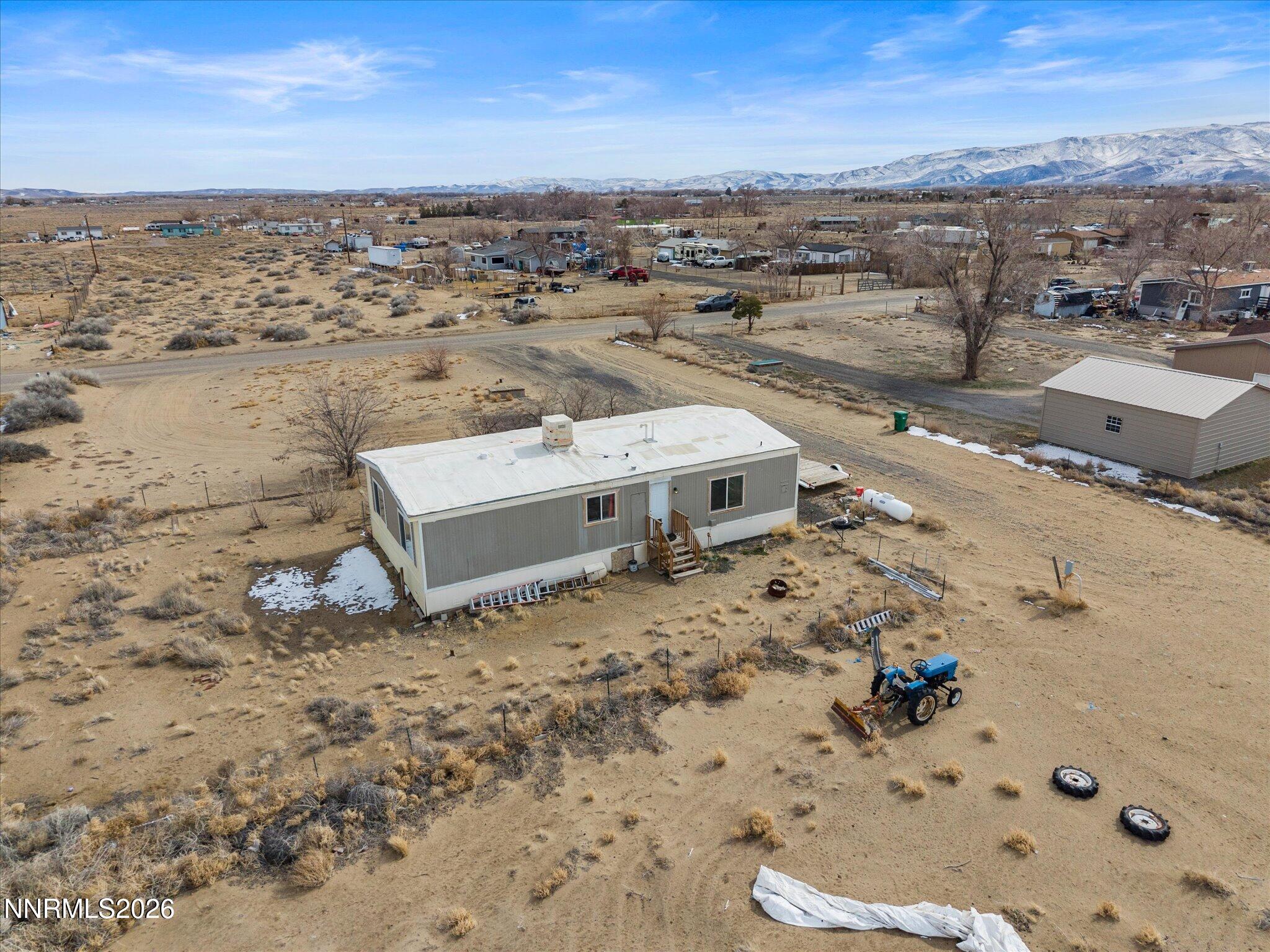 7815 Springfield Road Silver Springs, NV 89429 - Photo 39 of 46 an aerial view of a house with a yard