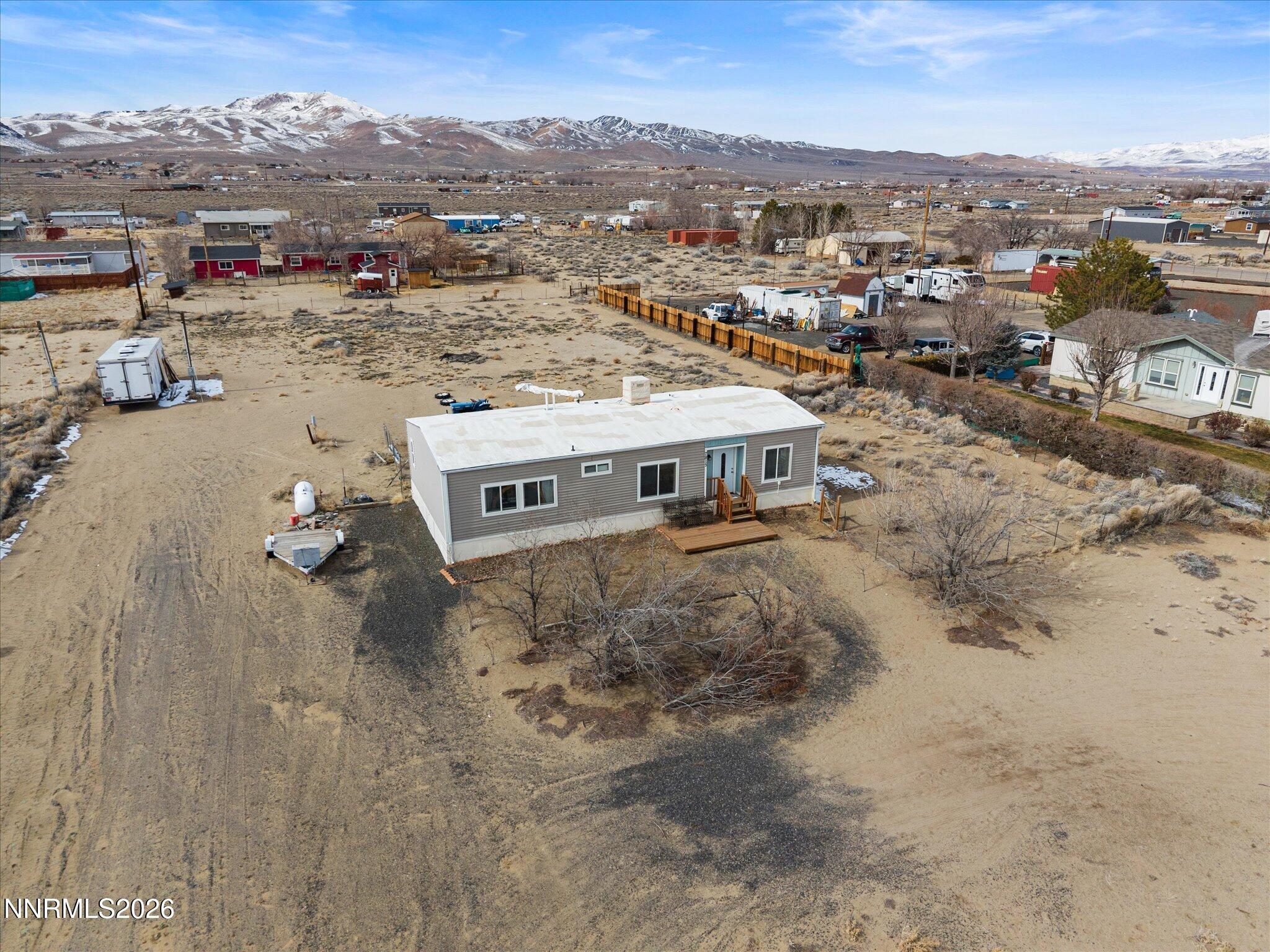 7815 Springfield Road Silver Springs, NV 89429 - Photo 40 of 46 an aerial view of a house with a yard