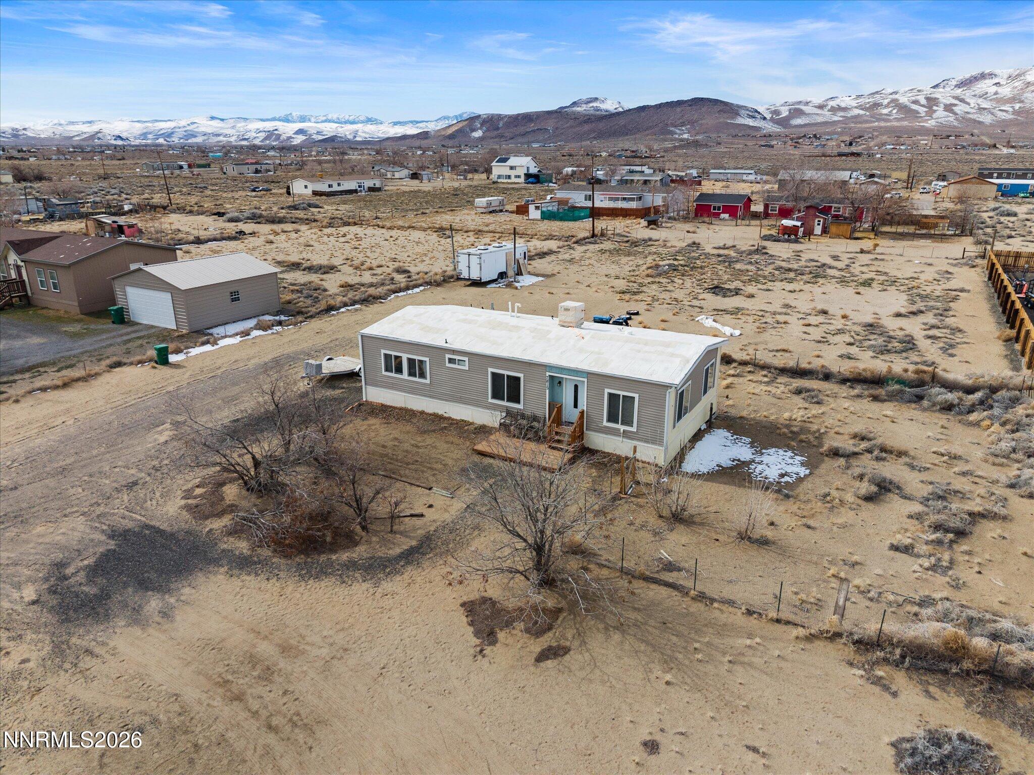 7815 Springfield Road Silver Springs, NV 89429 - Photo 41 of 46 an aerial view of a house with a mountain