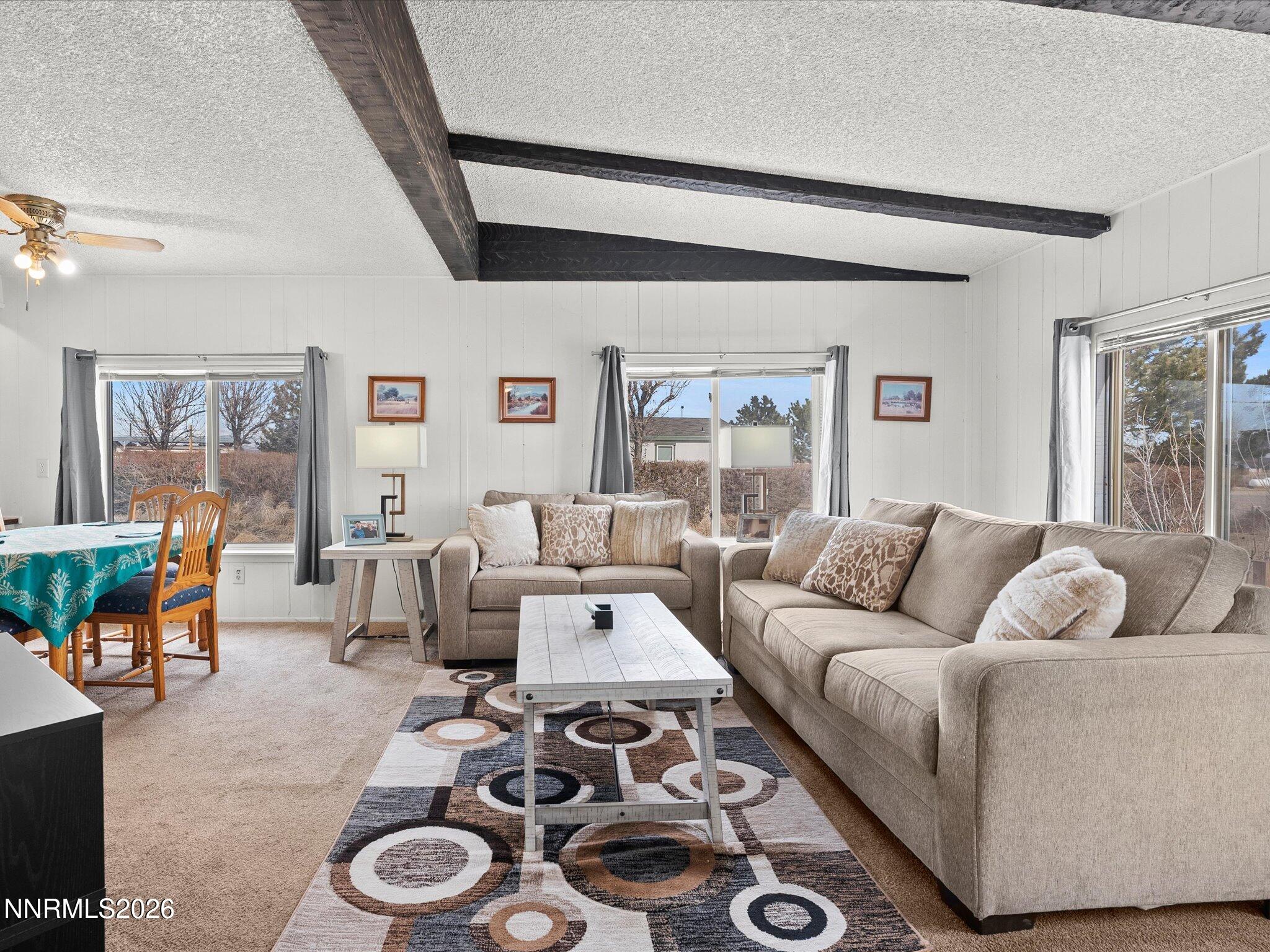 7815 Springfield Road Silver Springs, NV 89429 - Photo 8 of 46 a living room with furniture and a couch