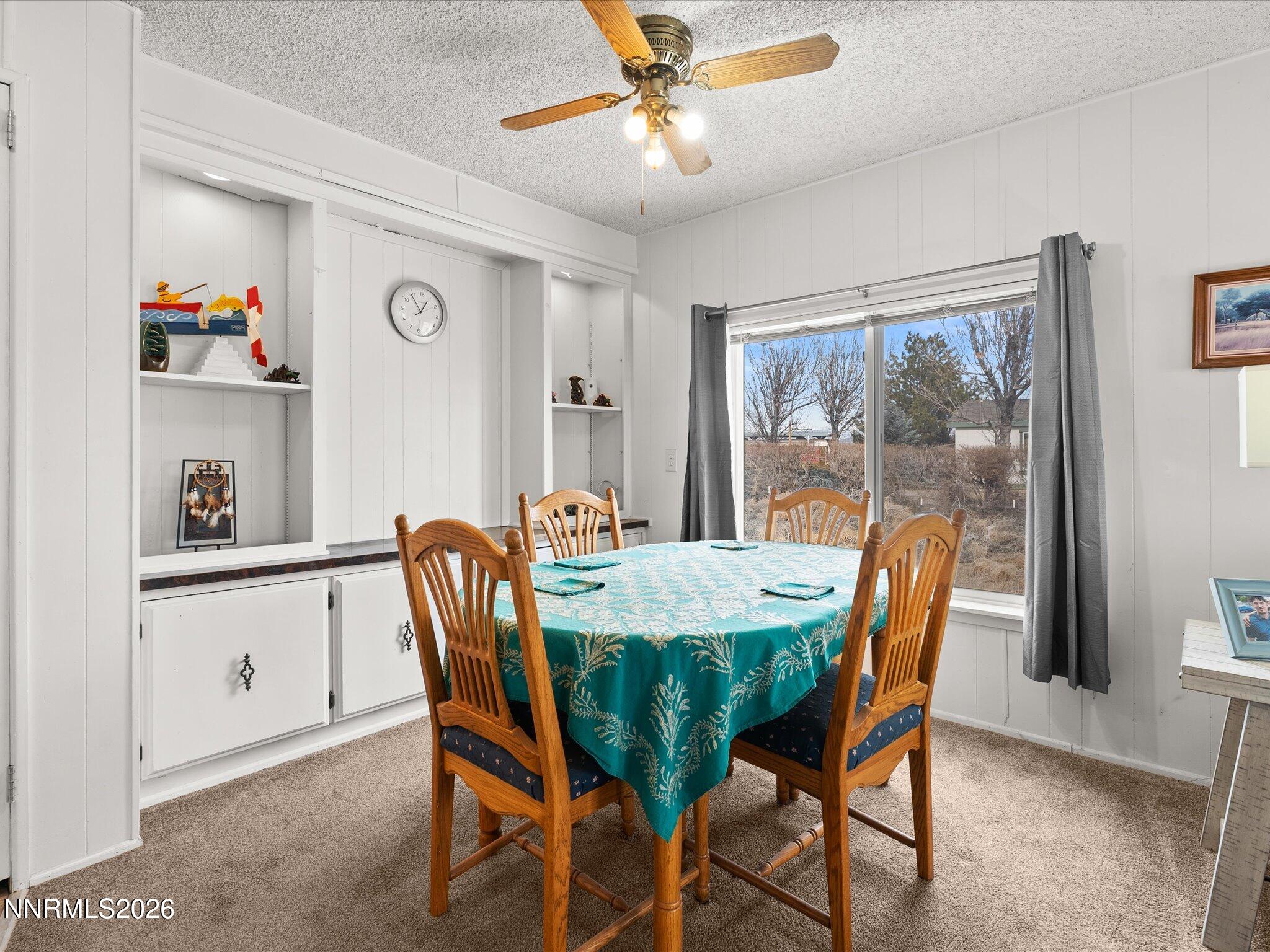 7815 Springfield Road Silver Springs, NV 89429 - Photo 10 of 46 a dining room with furniture and window