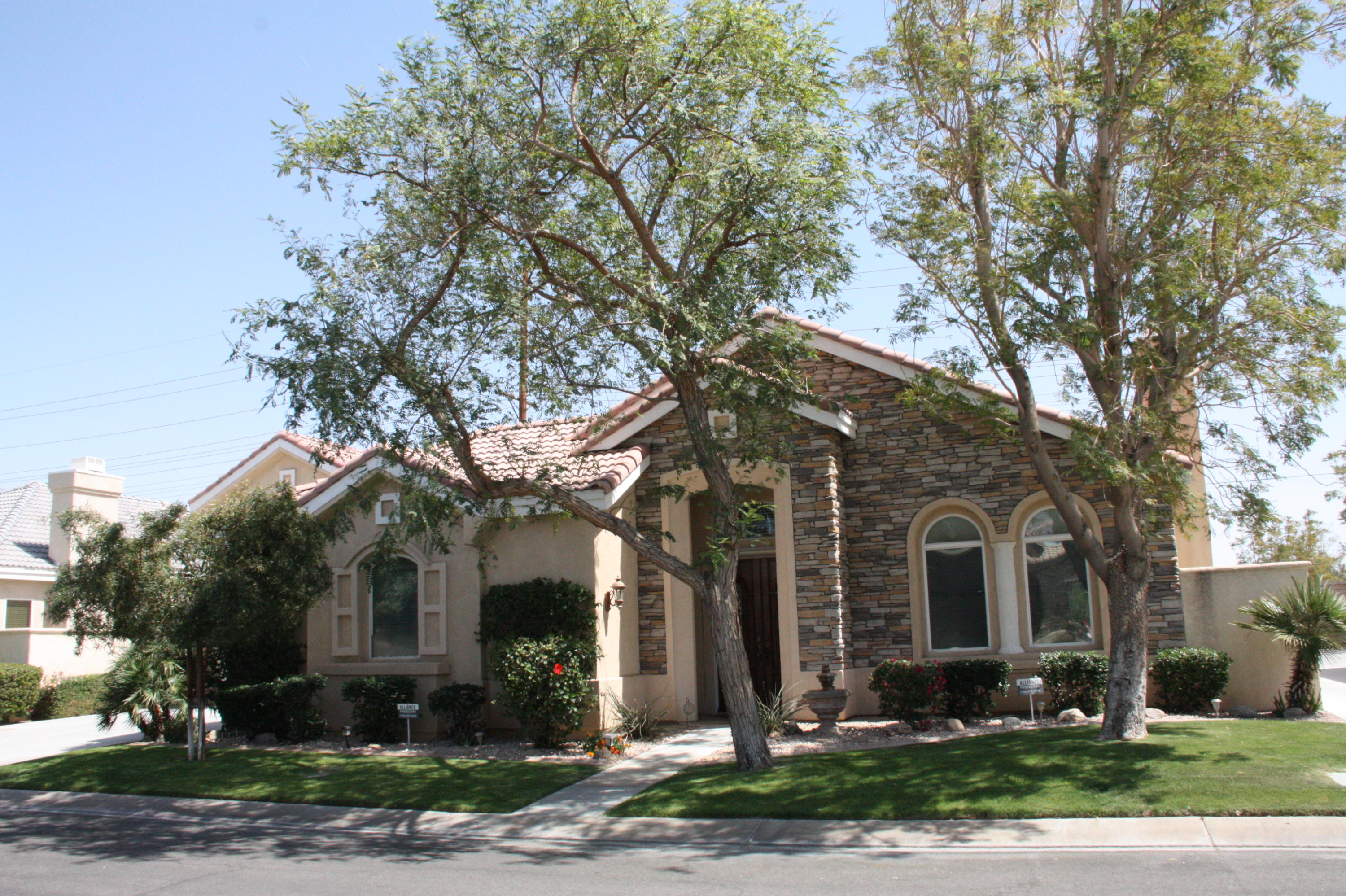 49758 Lewis Road Indio, CA 92201 - Photo 2 of 47 front view of house with a street