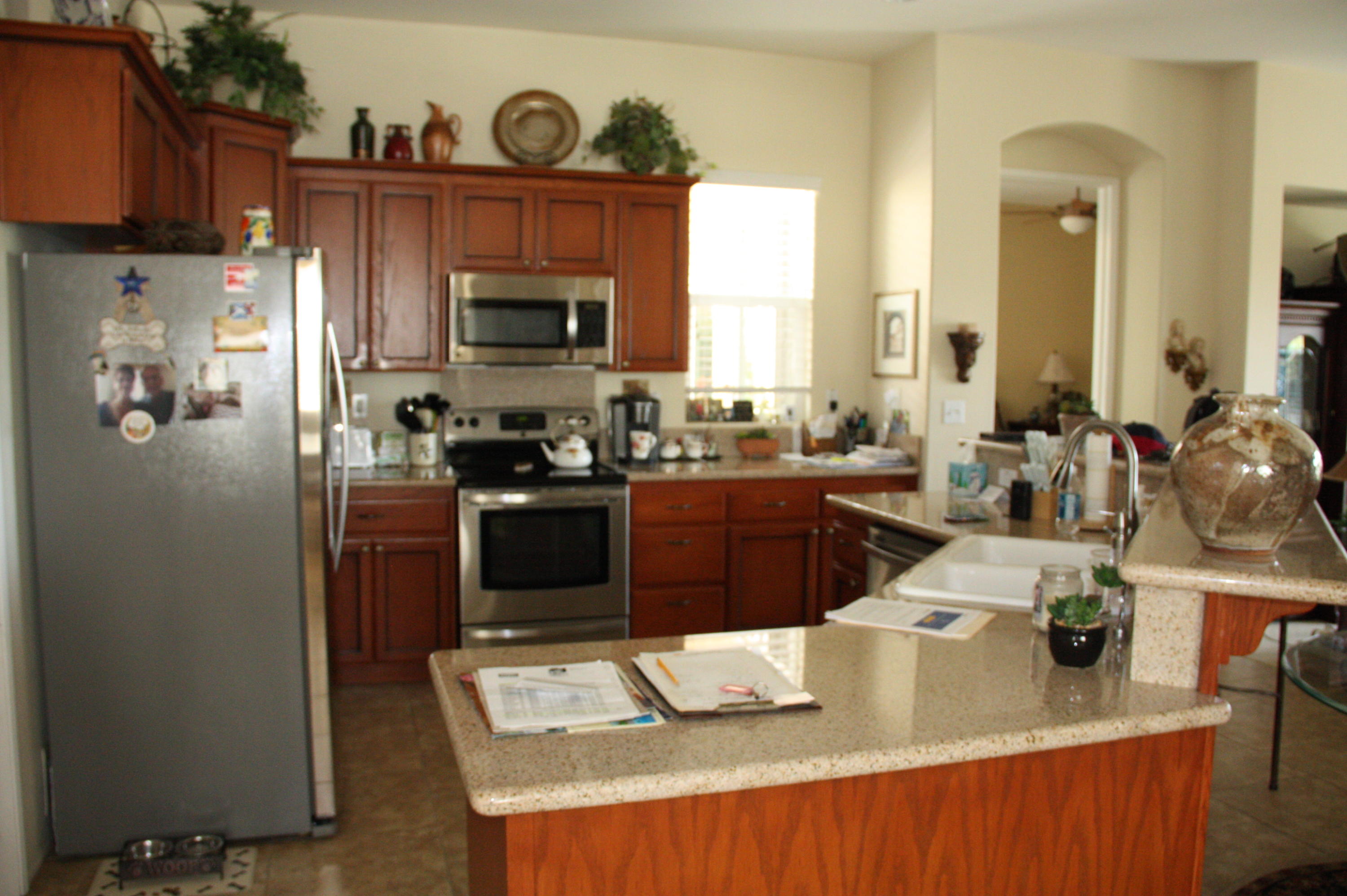 49758 Lewis Road Indio, CA 92201 - Photo 12 of 47 a kitchen with stainless steel appliances granite countertop a sink stove and refrigerator