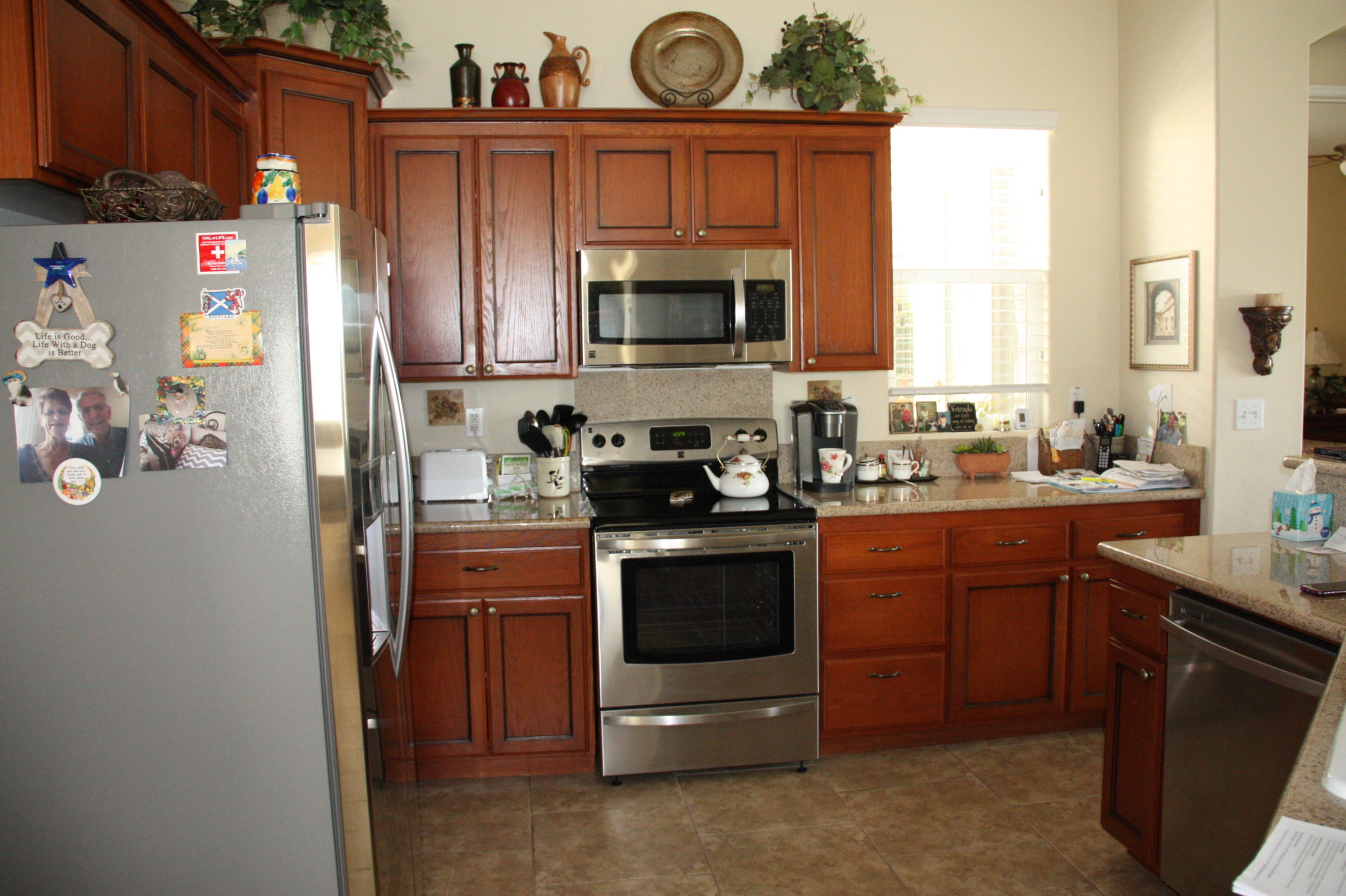 49758 Lewis Road Indio, CA 92201 - Photo 13 of 47 a kitchen with stainless steel appliances granite countertop a refrigerator stove and sink