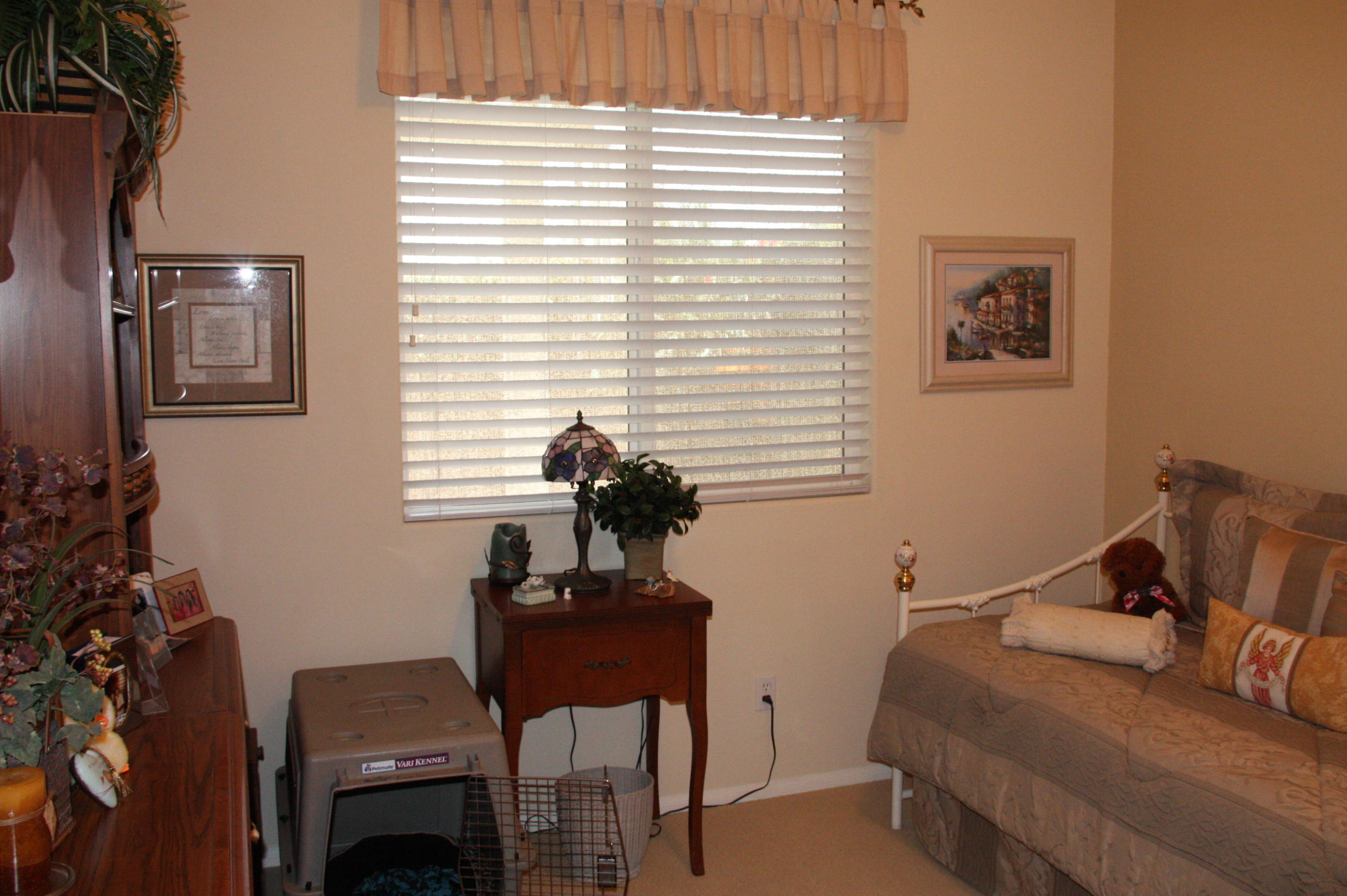 49758 Lewis Road Indio, CA 92201 - Photo 20 of 47 a bedroom with a bed and a potted plant