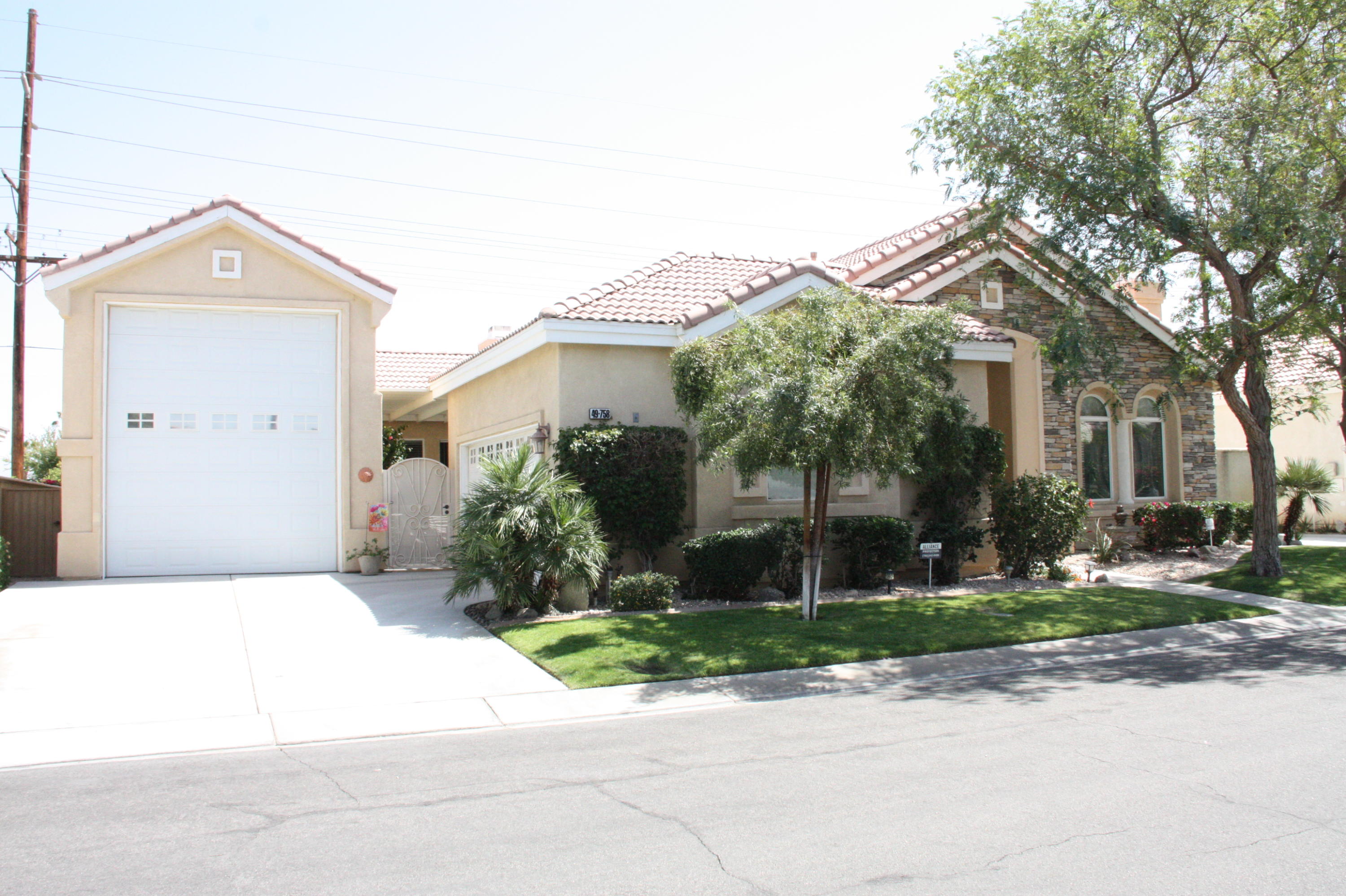 49758 Lewis Road Indio, CA 92201 - Photo 3 of 47 front view of a house with a yard