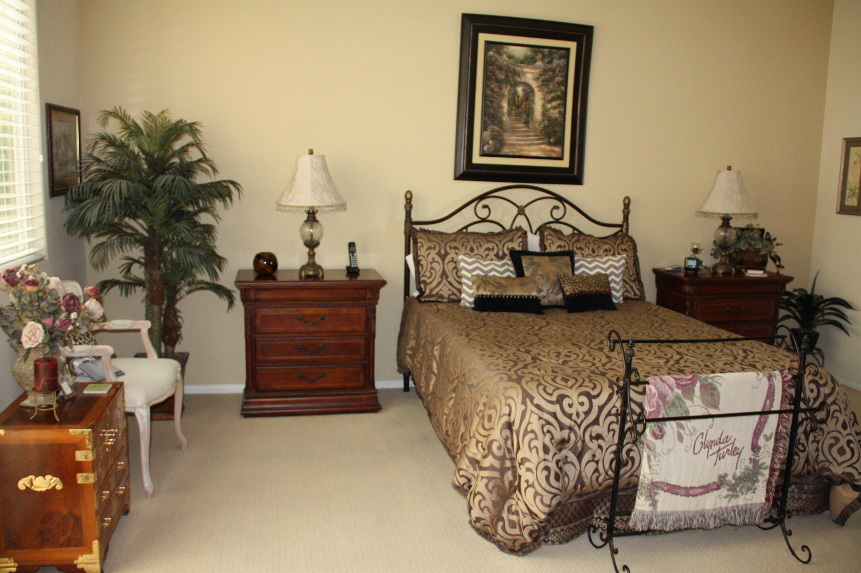 49758 Lewis Road Indio, CA 92201 - Photo 30 of 47 a bed sitting in a bedroom next to a window