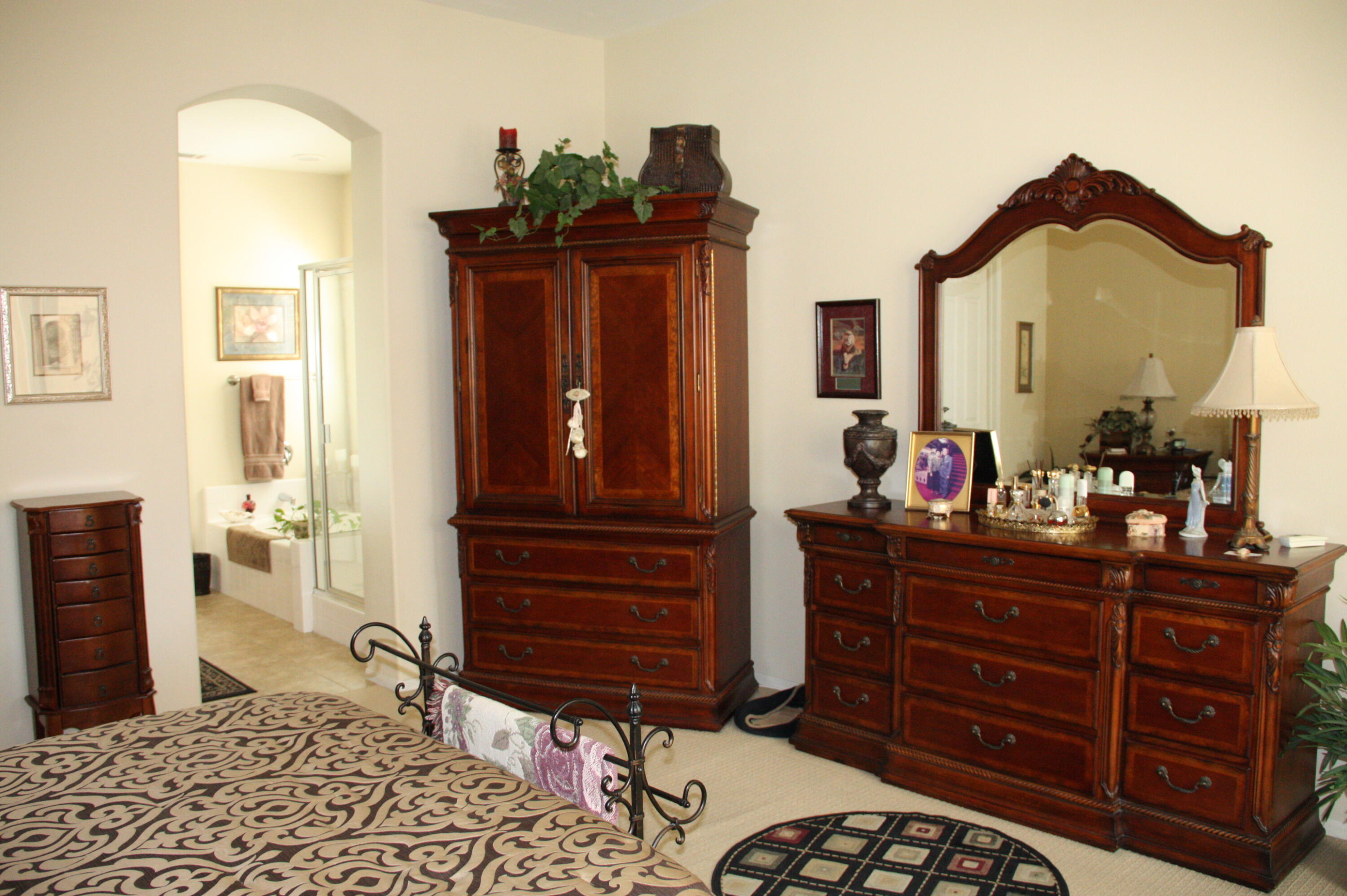49758 Lewis Road Indio, CA 92201 - Photo 31 of 47 a bedroom with a bed and a dresser